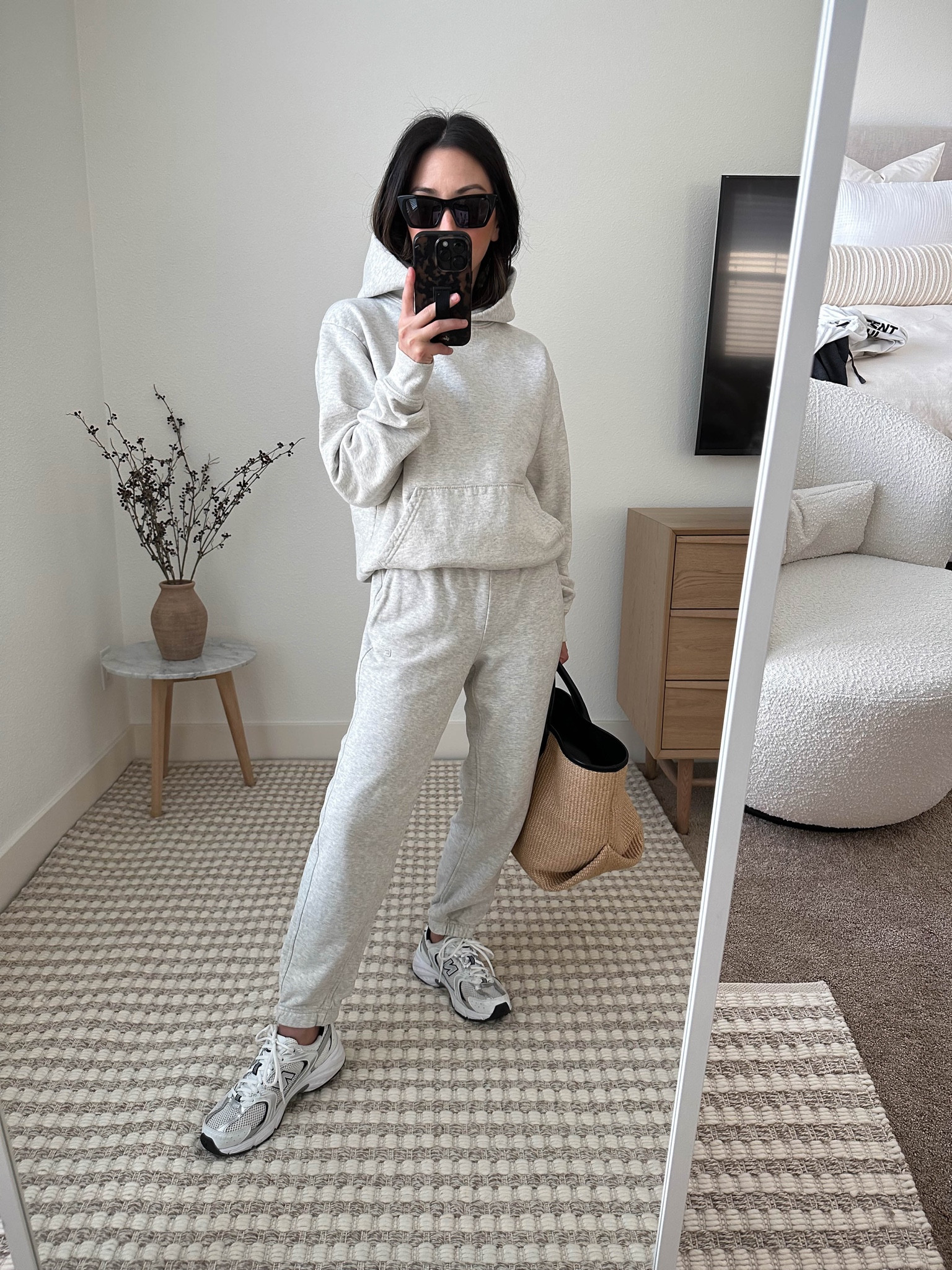 Travel outfit. Sporty & Rich hoodie. 
Gray sweatsuit  

Hoodie - Sporty & Rich xs. Runs small size up. 
Sweats - Everlane xxs
Sneakers - New Balance 4.5 
Tote - Khaite 
Sunglasses - YSL Mica

#LTKitbag #LTKshoecrush #LTKtravel