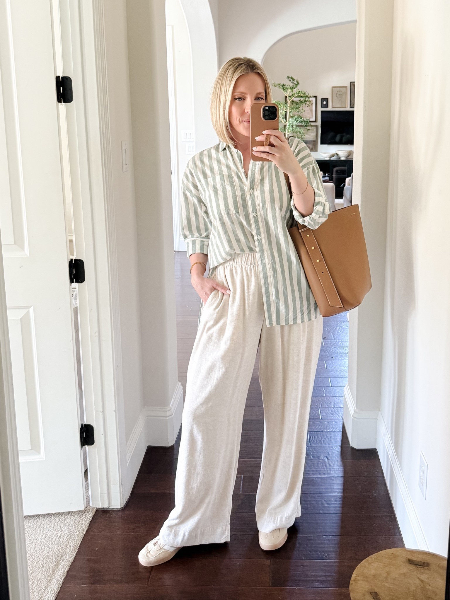 Laid back Spring outfit idea: Stripe button up and wide leg linen pants with neutral Adidas Gazelle

My new tan leather tote is incredible!  So happy with this purchase.



#LTKMidsize #LTKOver40