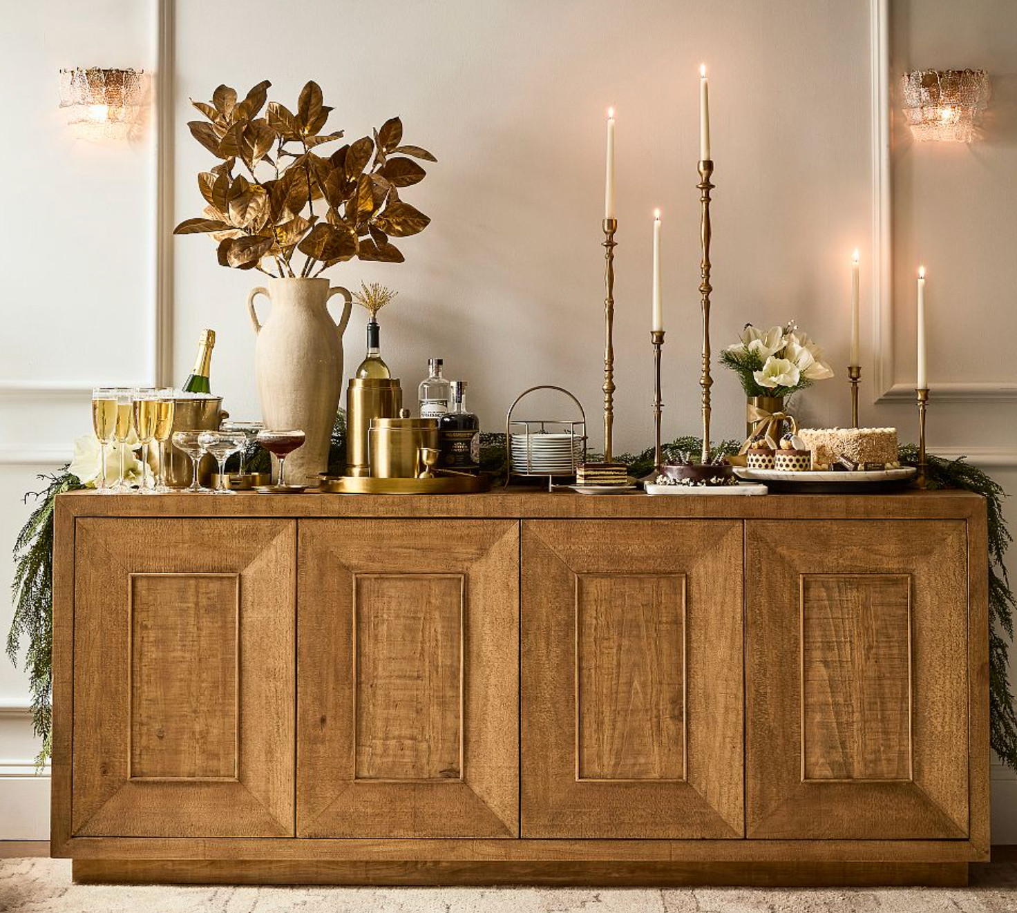 Buffett Table 
Expertly crafted of solid reclaimed pine wood.
Finished by hand in Rustic Harvest.
Wood may feature natural variants like knots.
Features 4 swing-out doors with adjustable shelf behind the doors.
Magnets keep doors secure.
2 Cord cut-outs at back of buffet.
Expertly crafted of kiln-dried wood. Kiln-dried wood helps prevent warping, splitting, cracking, and developing mildew. Pottery Barn.  

 #LTKHome