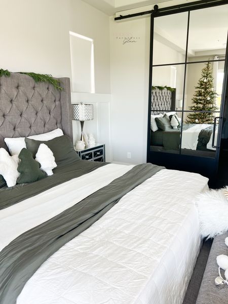 Master bedroom with Christmas tree at Modern Farmhouse Glam. Use code FARMHOUSEGLAM40 for 40% off my bamboo sheets. 

Bed barn door metal door 

#LTKhome #LTKSeasonal #LTKHoliday