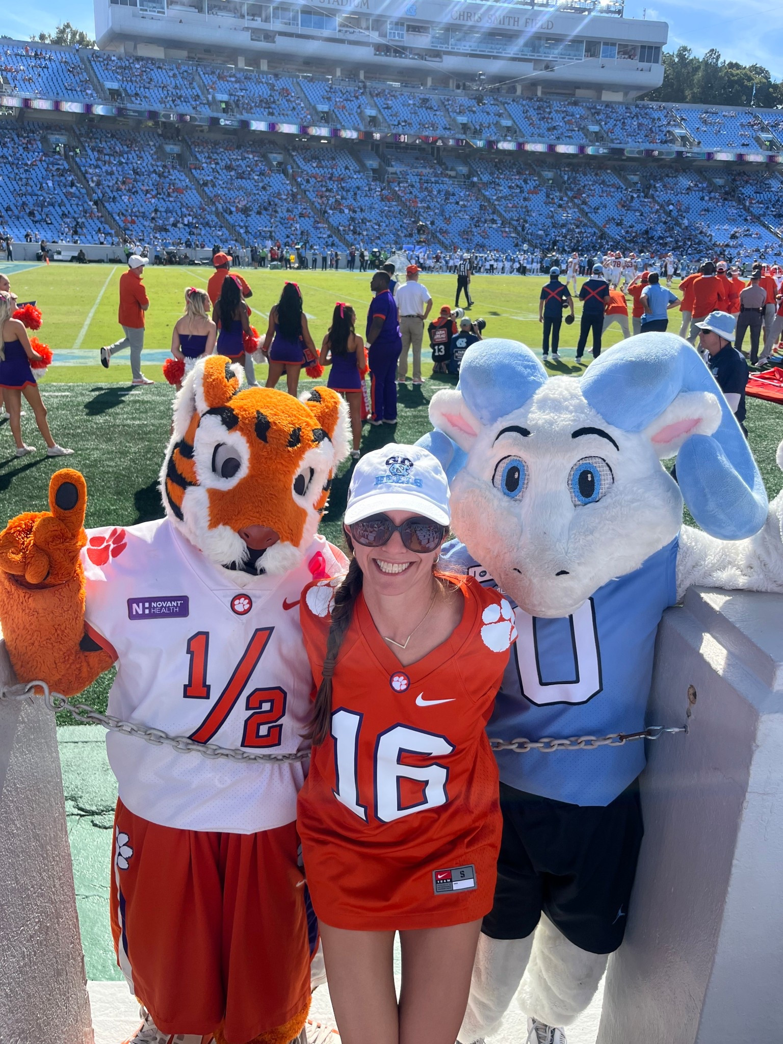 That epic moment when you get a photo opp with your two favorite mascots at the same time! 🐯🐏Loved being reunited with Cubby at the Clemson-UNC game and glad RJ got to join us as well. 🧡🩵
Plus the Tigers finally got another win! 

My parents made me wear a UNC hat in order to use one of their tickets, but you bet I wore my Clemson jersey and was pulling for the Tigers! 🐅 

I’ve linked my official Clemson Nike jersey, my Kendra Scott huggie earrings, and other gameday outfit attire that you can’t see in this pic, including the best fall boots!



#LTKStyleTip #LTKPetite