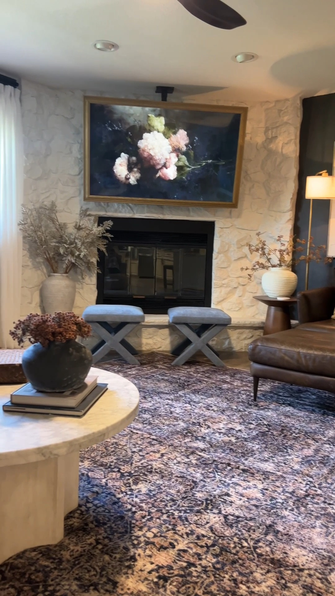 Our living room has slowly become one of my favorite spaces in our home. 🖤
The paint color is Sherwin-Williams Peppercorn, lightened by 50%, and it has become one of my all-time favorite moody paint colors. I used this same color in our Idaho home and now in multiple spaces throughout our Florida home. Depending on how the light hits it, it can read as a deep gray, blue, or even almost black, giving it so much depth and character.

I am also absolutely loving this rug! It incorporates one of my favorite color palettes, is incredibly soft underfoot, washable, and such an amazing value. 

This room has a lot of unique angles and tricky dimensions, so the 10’ × 14’ was actually the largest rug that would fit the space while still working with the layout.

Some of the furniture in this room is from Furniture Row, including:
• Grandover 4-Piece Sectional (Left Chaise)
• Pulaski Accents 40” Marble Coffee Table
• Tuscany Chair
• Balanced Floor Lamp (mine is the black finish, but I’m not sure if that color is still available on their website).

#LTKHome