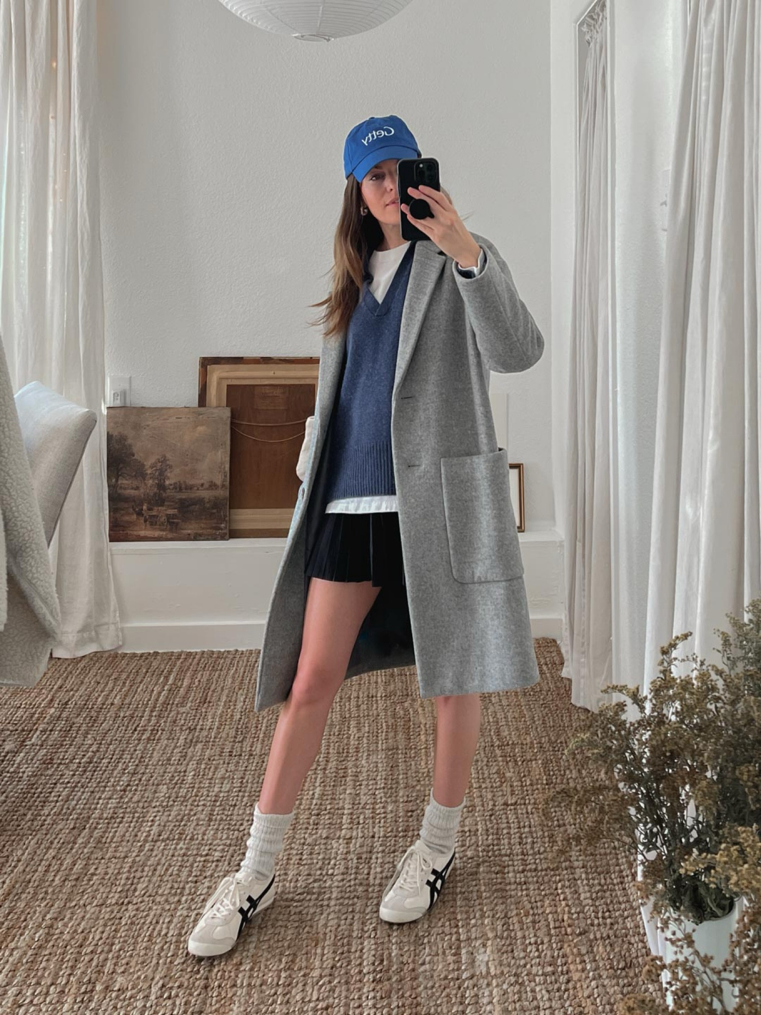 Casual winter outfit featuring a big cozy coat, cashmere polo sweater, alo tennis skirt, and sneakers. 

#LTKU #LTKActive #LTKStyleTip