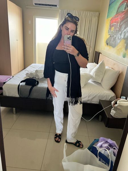 Vacation outfit 

White pants, linen pants, black sandals, midsize outfit, rosette top, y2k top, vacation outfit, summer outfit 

#LTKmidsize #LTKSeasonal #LTKstyletip