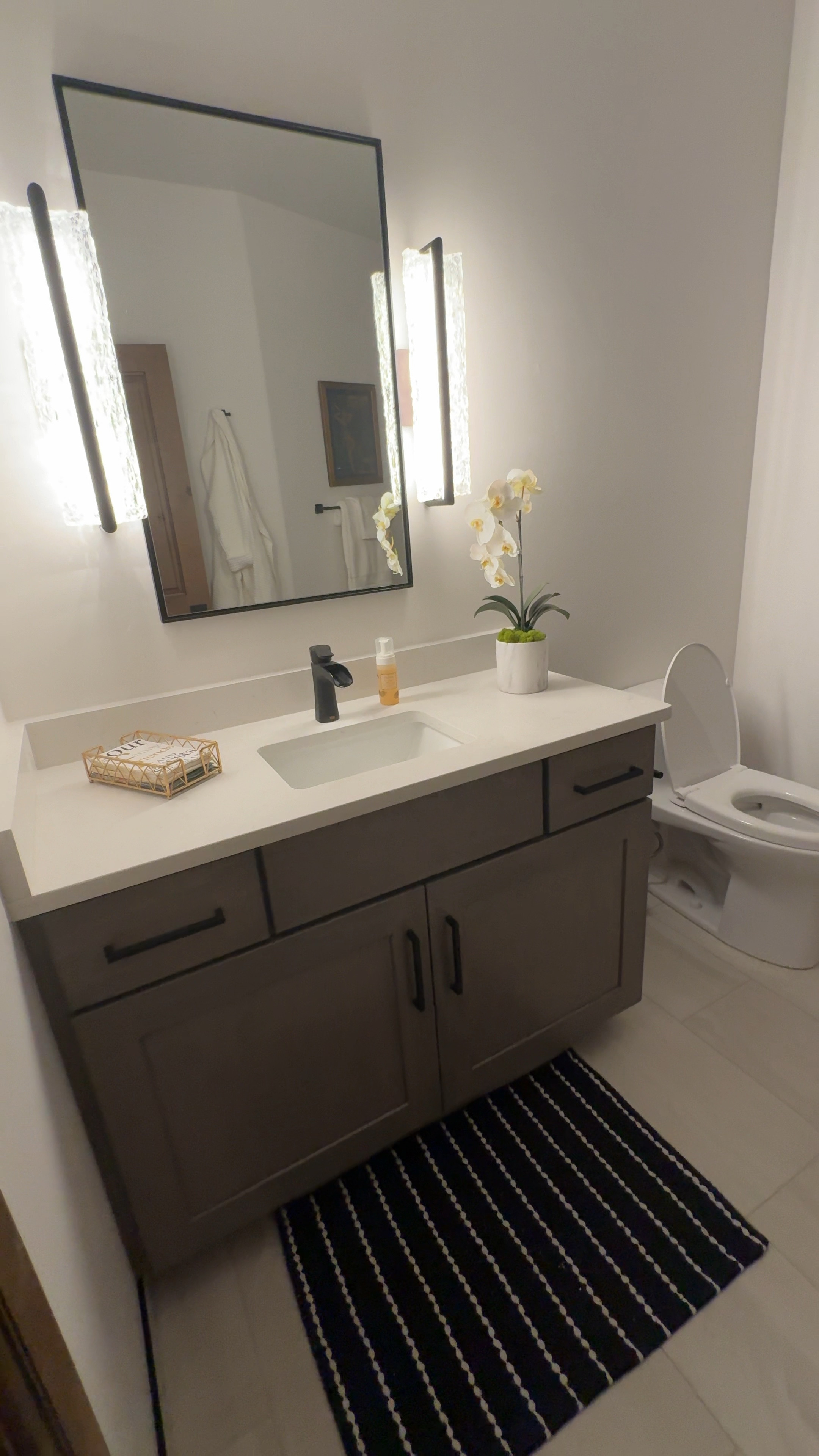Our guest bathroom at our Villa in Montrose, Colorado.
Wood Trash can, wood soap dish, orchid, guest towel holder. Tree stump side table. Copper bowl by Nambu, 

#LTKFindsUnder100 #LTKHome #LTKVideo