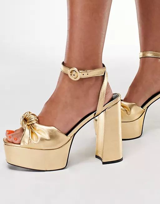 ASOS DESIGN Wide Fit Note knotted platform heeled sandals in gold | ASOS (Global)