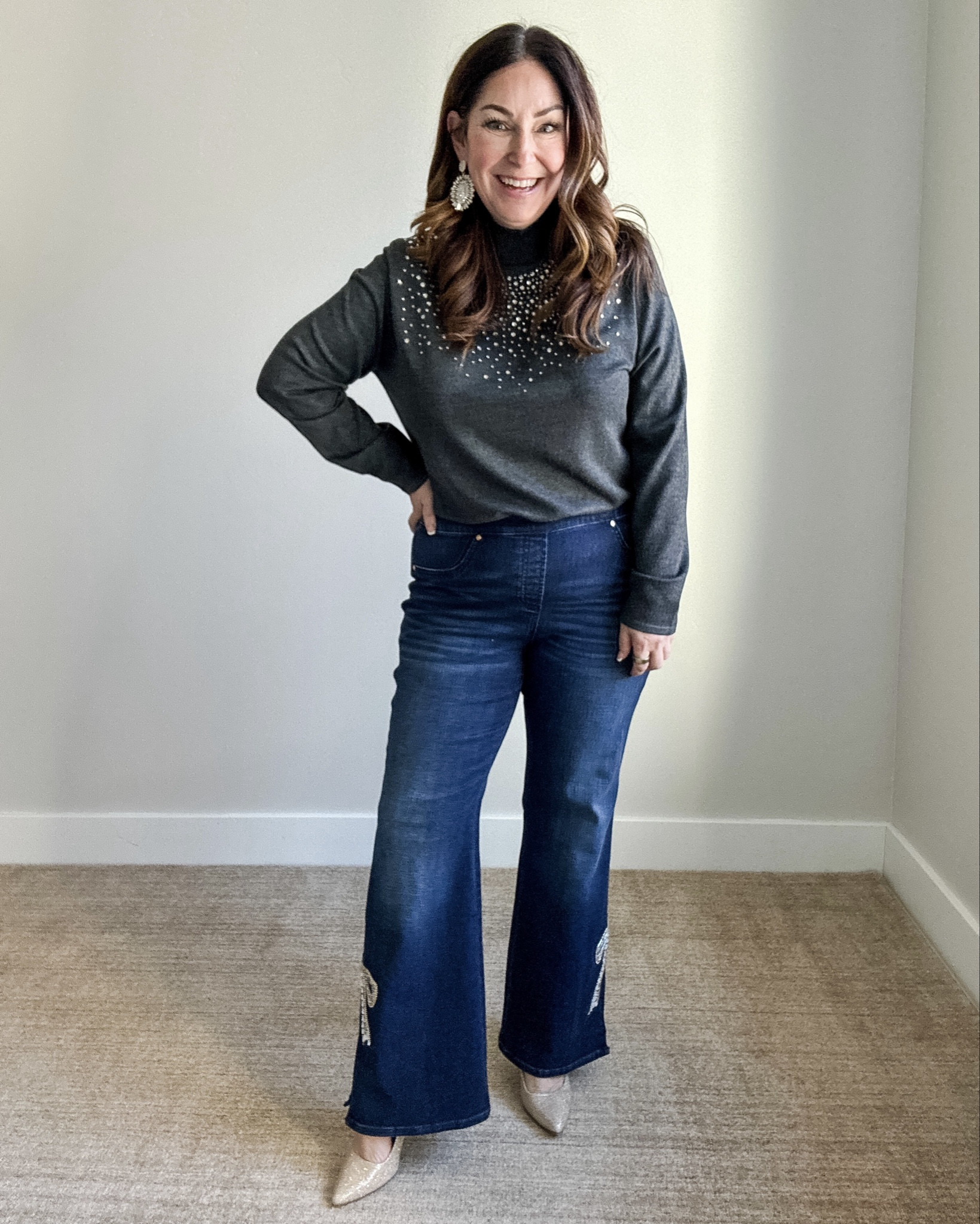 Holiday Outfit with pull on bow jeans and embellish sweater wearing large in sweater, (2) large in jeans  

 #LTKHoliday #LTKOver40 #LTKMidsize