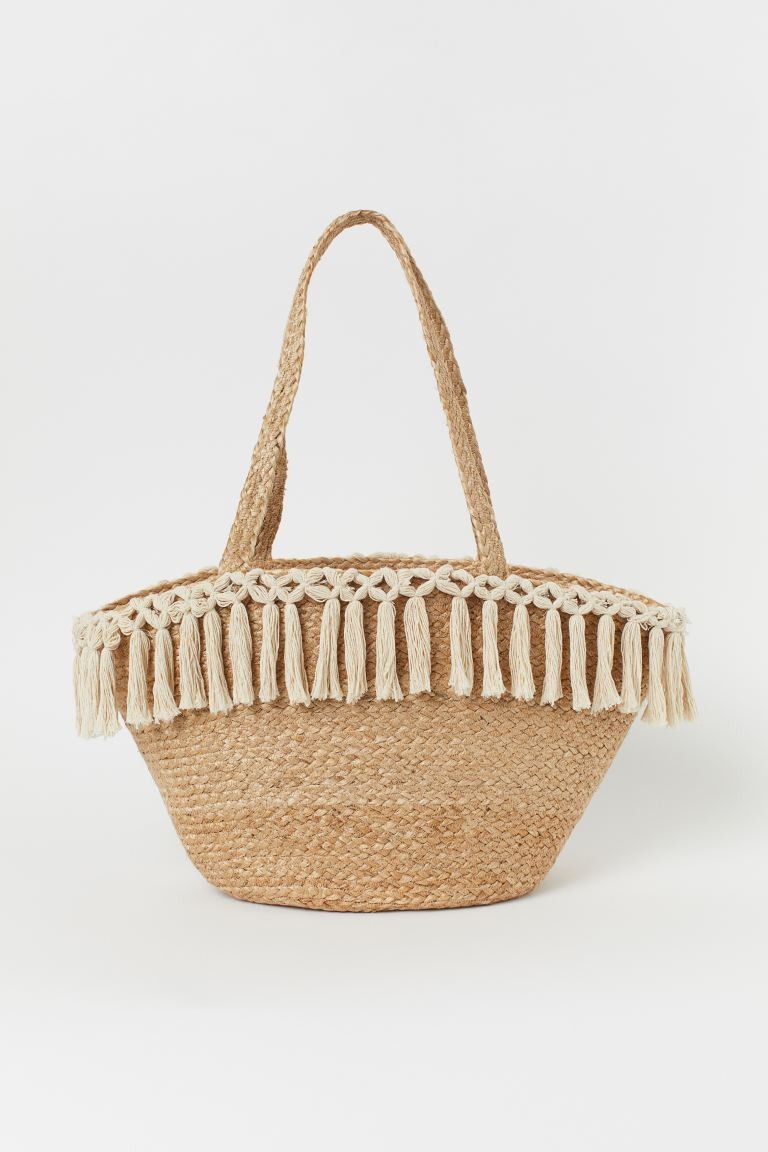 Handmade beach bag in braided jute decorated with cotton tassels. Two handles. Unlined. Depth 7 3... | H&M (US + CA)