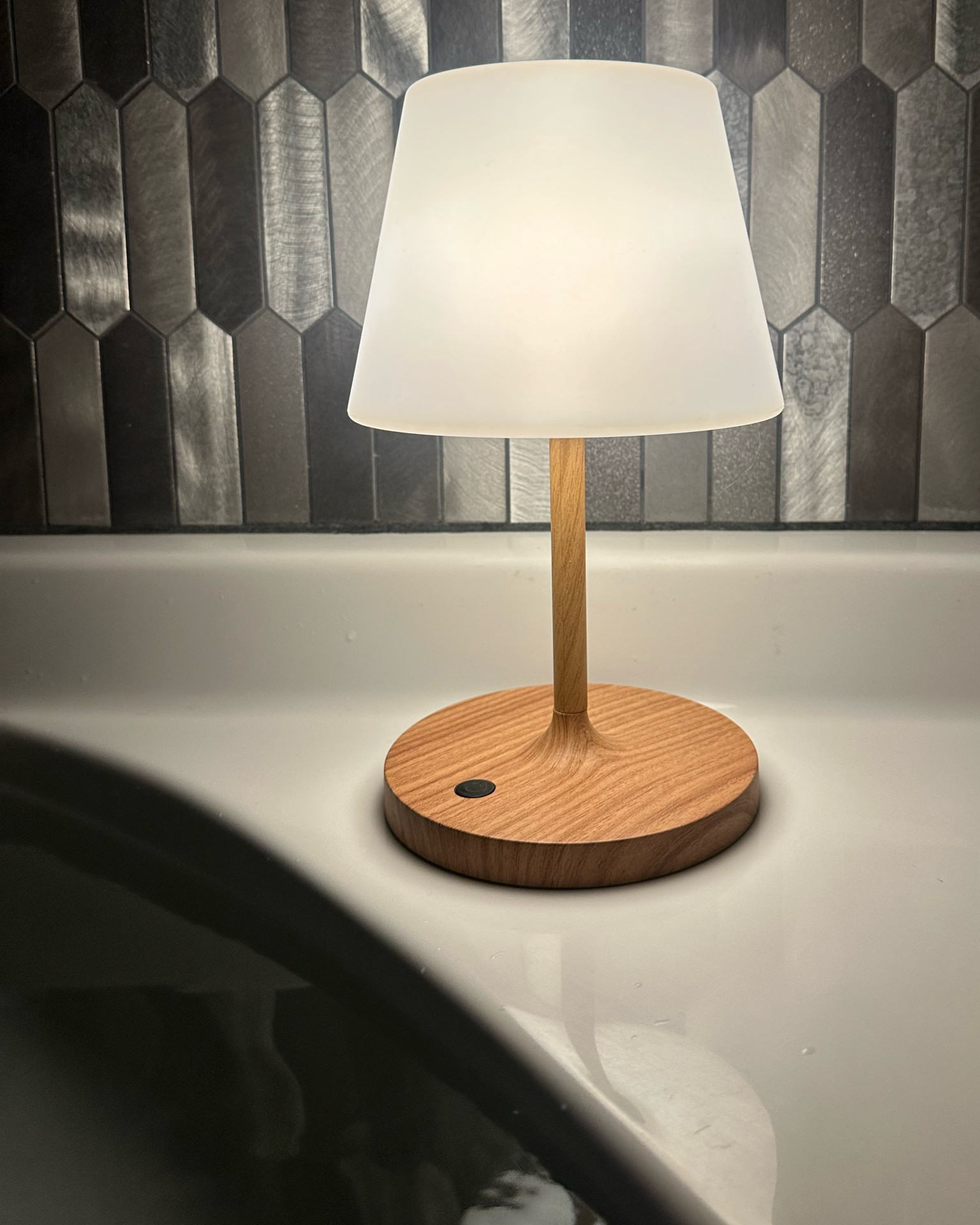One of my fav ways to wind down after getting my kiddos to bed is a bath at night. I love turning off all the lights and just having this little waterproof lamp on near me. I start getting super over stimulated by the time the kiddos are going to bed, that when it’s time for me to relax, all the bright lights in the bathroom drive me crazy. 
I love this because it’s rechargeable, waterproof, holds a charge for a while & is dimmable!! I even love to put it on the shelf in our shower sometimes too!! 

#LTKBeauty