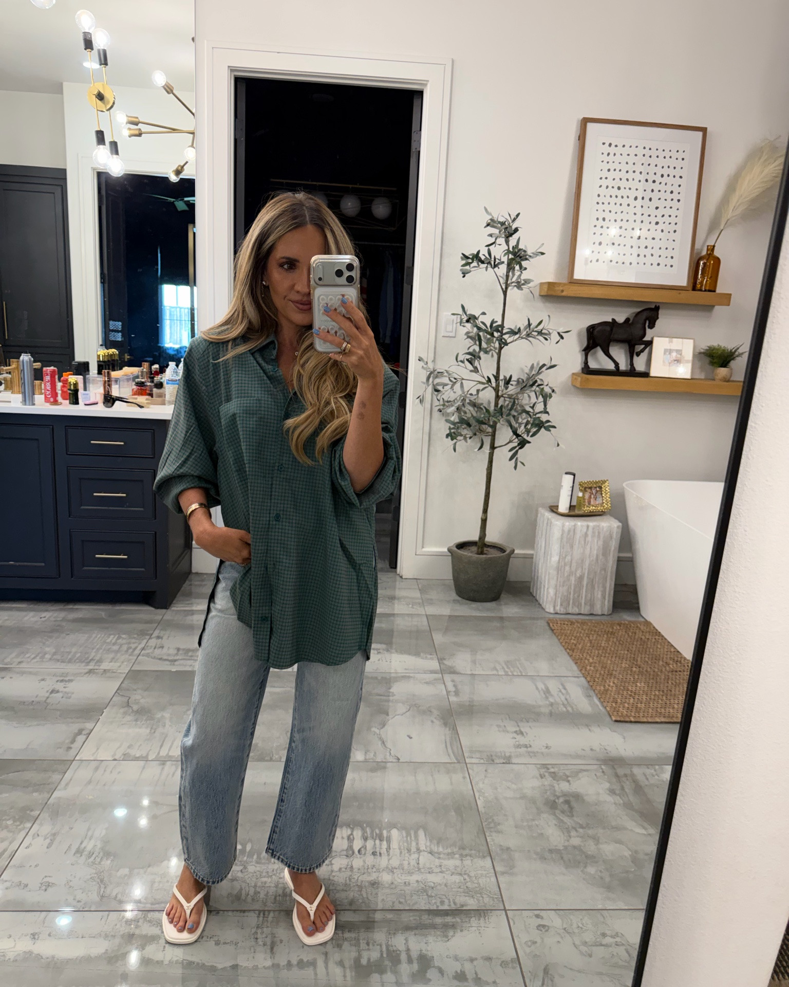 Outfit of the day - xxs in top - this colorway sold out, but found it in another on sale! It runs oversized. Jeans are petite length size 24 - sandals are new Chanel

#LTKootd #LTKPetite #LTKOver40
