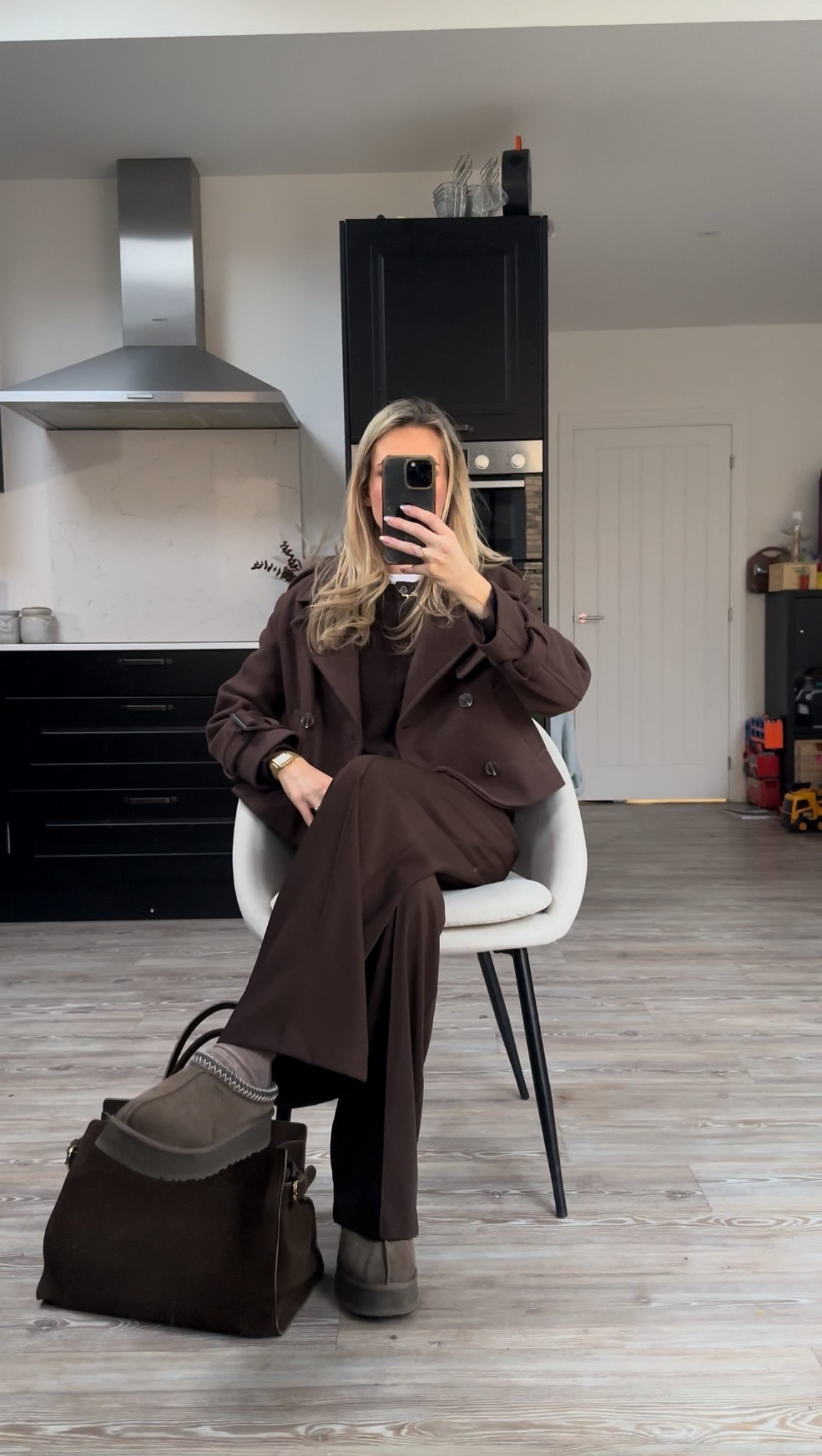 An all brown outfit idea for autumn styling brown trousers , brown cardigan layered with a white tee, brown Uggs and a cropped crown tench style wool coat 

#LTKautumn #LTKstyletip #LTKuk