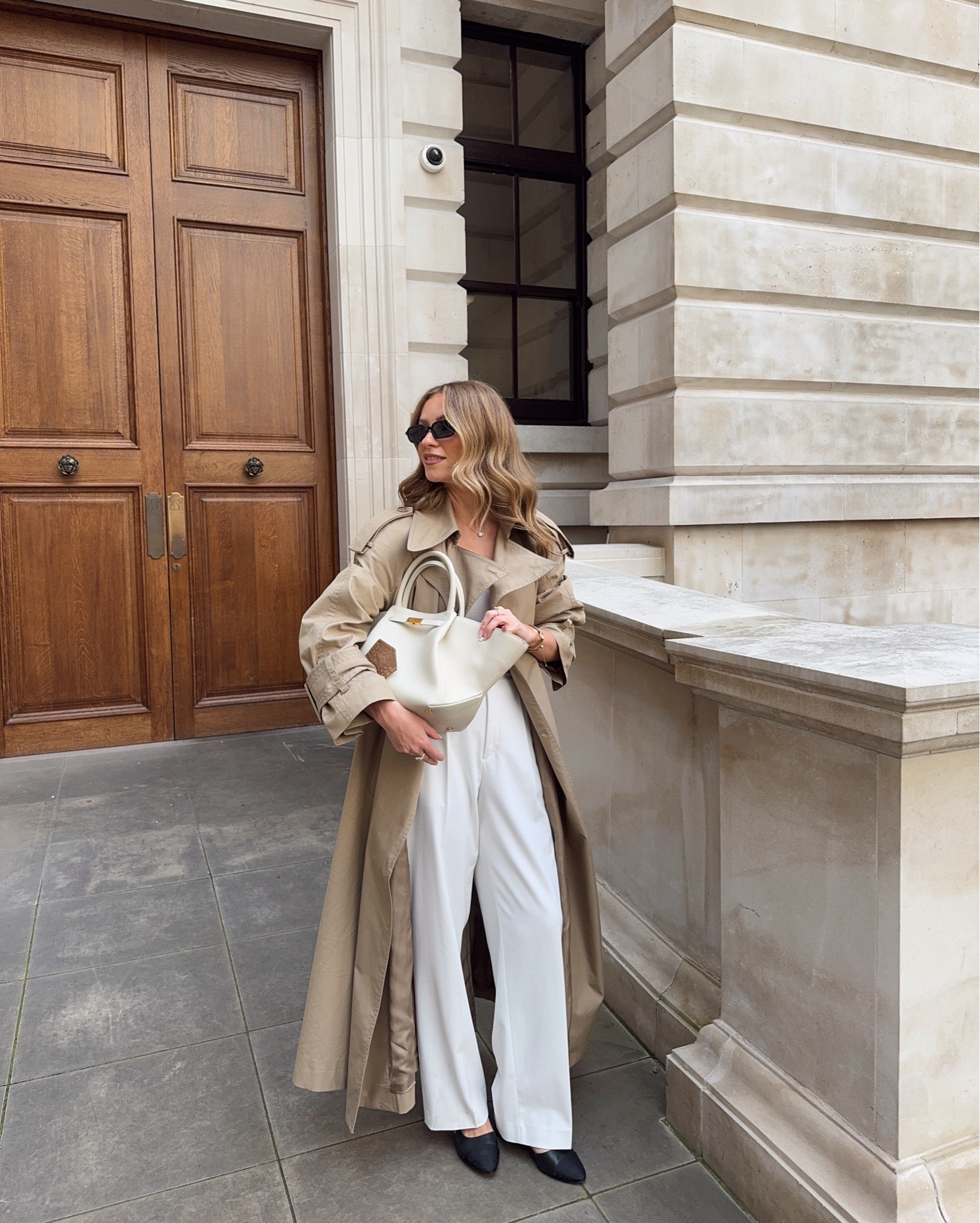 Trench - old &other stories
Trousers - old Uniqlo 
Shoes - old dune 
Bag - demellier 
Sunglasses - le specs 

Trench coat outfit, white tailored trousers, black slingbacks, white vest, demellier bag, 

#LTKuk #LTKspringtrends #LTKspring
