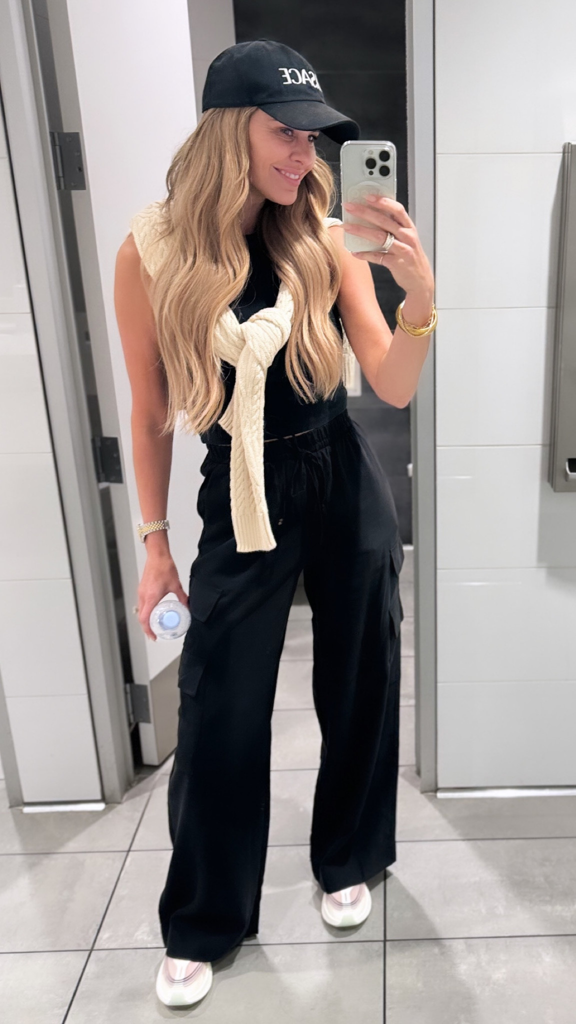 Easy travel look!  Style Tips: I hate wearing jeans on a plane so I love these cargos bc they are a lightweight twill with an elastic waistband…and I can pair them with sandals and a tank top too. I always wear my biggest shoes on the plane which are typically boots or sneakers! And don’t forget to grab a lightweight sweater and tie around your shoulders in case you get cold easily! // Sizing: black cargo pants/small, tank/small, sweater/medium, sneakers/TTS

#LTKstyletip #LTKfindsunder50 #LTKtravel