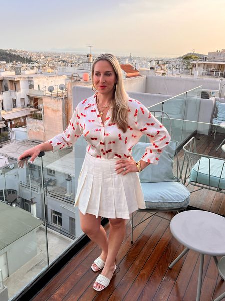 Summer outfit
Greece travel
Europe travel
White 
Tennis skirt
L’Agance Silk shirt - mine is older, but linking their currentl silk shirt print  

#LTKOver40 #LTKStyleTip