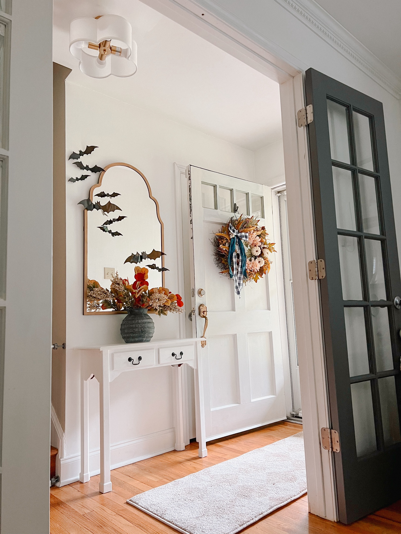 A little fall entryway. 🍂 Can you spot what’s wrong with this picture? 👀 #entryway 

#LTKSeasonal #LTKHalloween #LTKHome