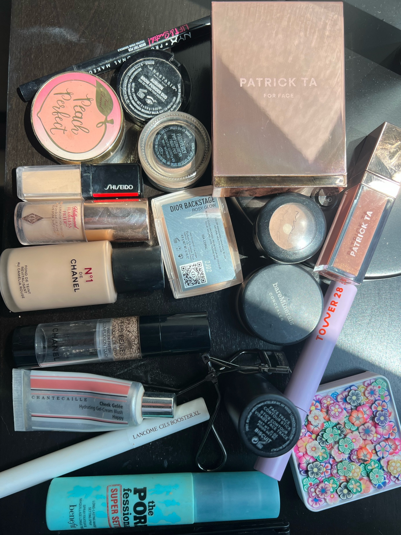 All the makeup I brought on my weekend trip. 
Shades: 
B20 in the Chanel No1 foundation; B30 in the #chanelwatertint;  
201 in the Shiseido concealer; 
Fair 2 in Charlotte tilbury flawless filter; 
Dior blush is in shade Coral;
#PatrickTa bronzer in She’s Sculpted;
Patrick Ta gloss in Superficial;
MAC paint pot in Painterly and an old single shadow in shade KID;
Chantecaille cream blush (that I use as a blush topper) in Happy;
westman Atelier cream contour in Biscuit;
Chantecaille blur powder (special edition packaging) in light;
couldn’t find a link to the Nyk NYX Professional Makeup Lift and Snatch Eyebrow Tint - I am in shade auburn;
tarte peach perfect powder is discontinued :-( 

#LTKbeauty