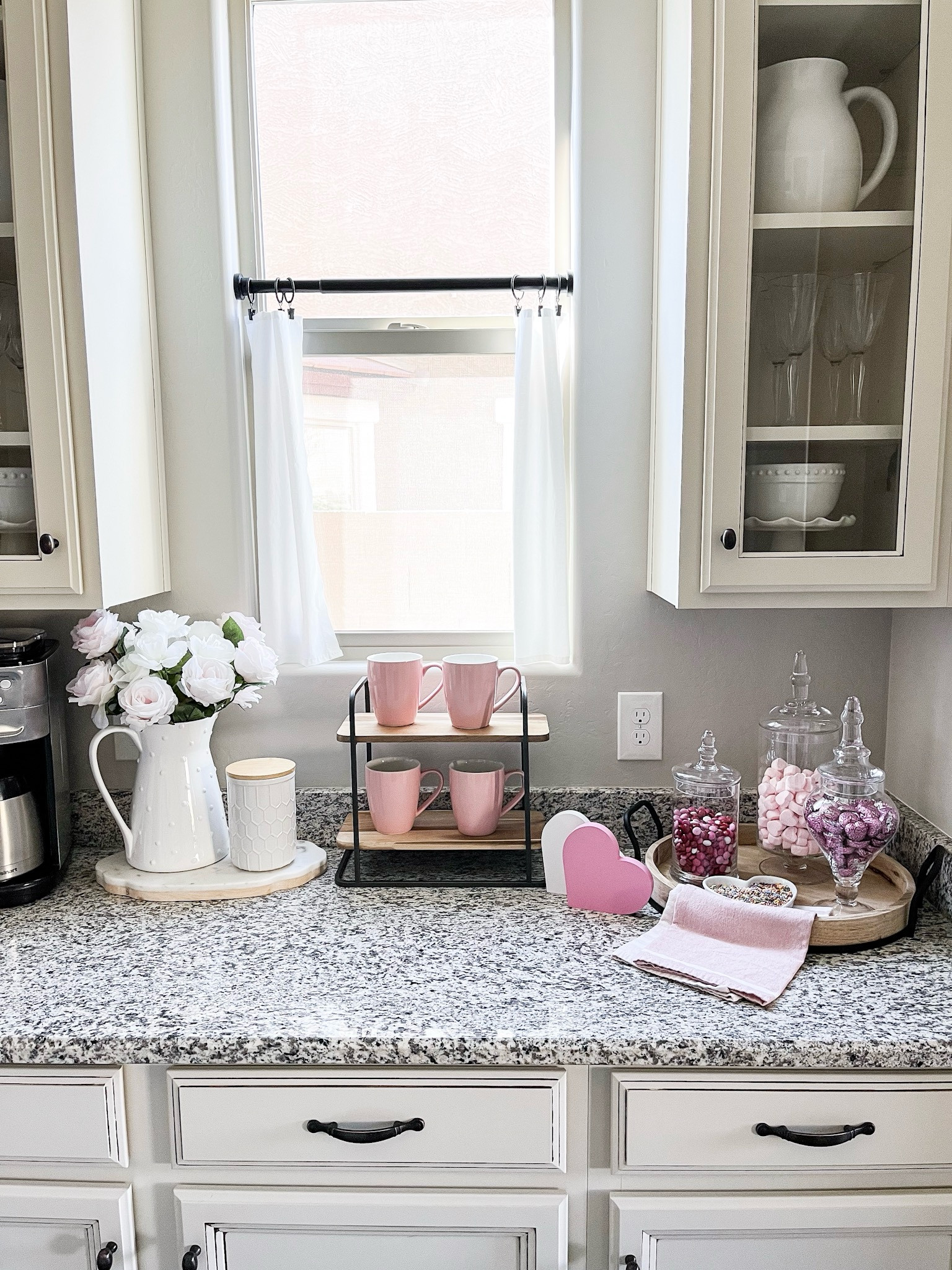 Valentine's cocoa and coffee bar! Follow @lifeinmyarizonahome
on Instagram for more inspiration.

Rectangle two tiered wood serving tray | round wood tray l pink mugs glass candy jar | white pitcher pink and white roses | wooden hearts | pink dish towels

#LTKFindsUnder50 #LTKSeasonal #LTKHome