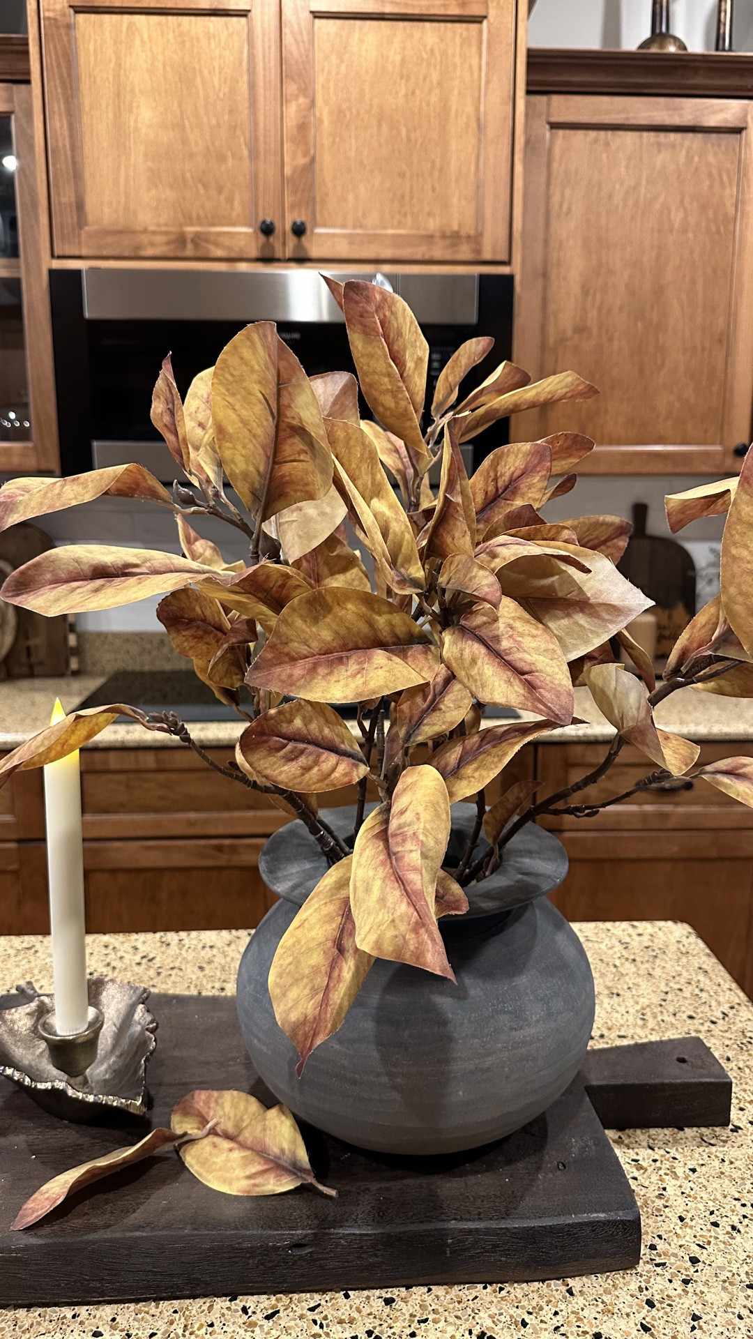 Sometimes you just need a centerpiece without all the extras. I used this beautiful vase that holds my stems perfectly I used 3 stems to create this beautiful arrangement. I laid a couple of leaves on my bread board 🍂. I added a candle for a little ambience.

#LTKSeasonal #LTKHome