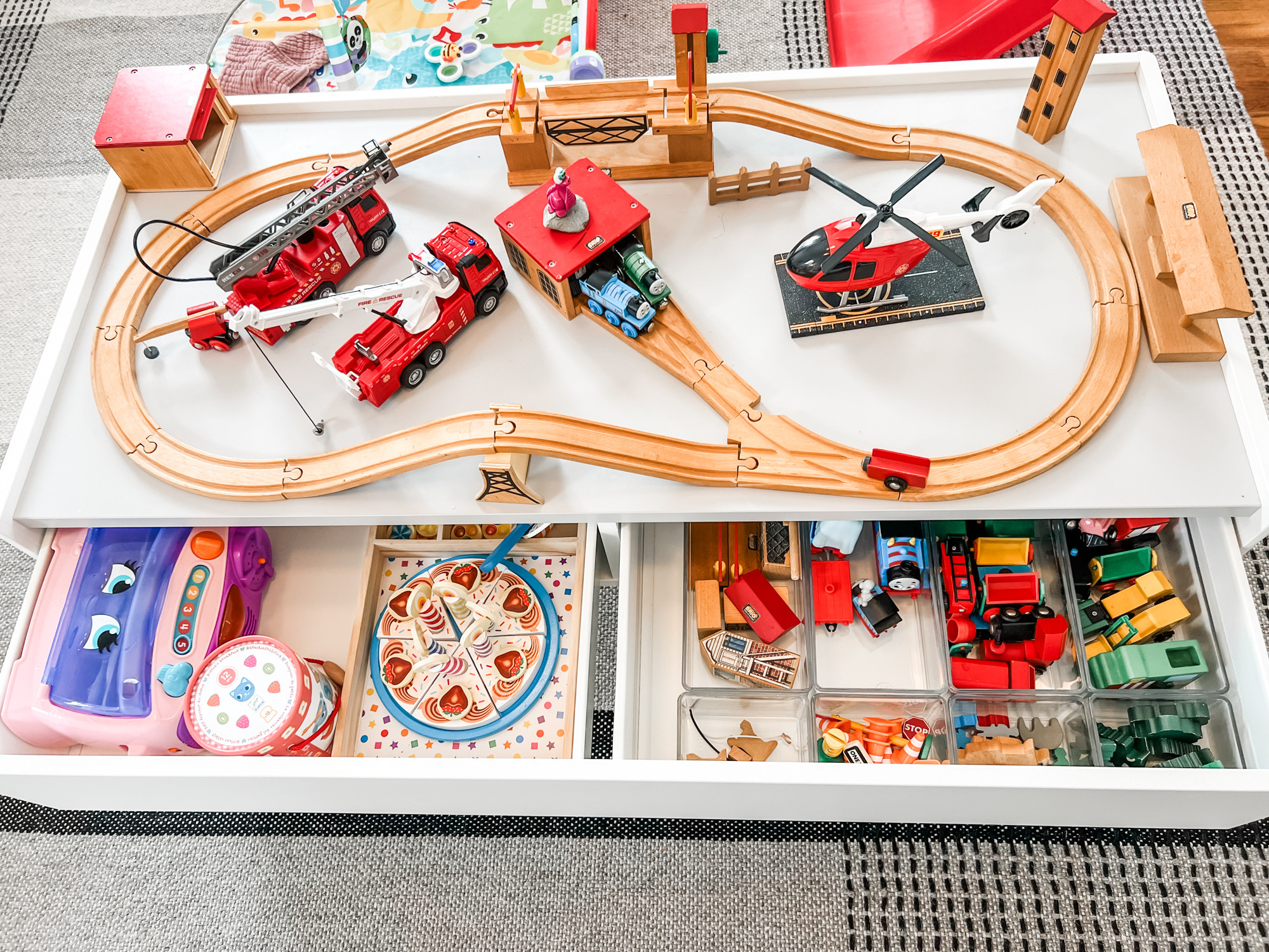 Corralling your kid's trains in a drawer is good, but organizing them into acrylic drawer organizers is even better! 🚂 

 