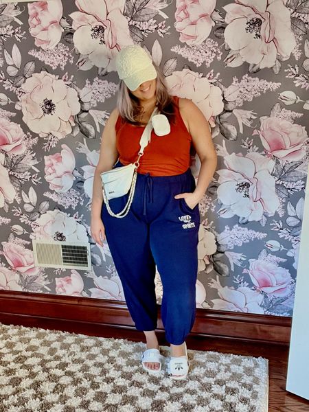 ✨SIZING•PRODUCT INFO✨
⏺ Blue Sweatpants Joggers - sized up to an XXL for a baggier fit, could probably wear an XL (clearance!) @walmartfashion 
⏺ Burnt Orange Scoopneck Stretchy Fitted Tank - XL - runs small @walmartfashion 
⏺ White Crossbody Bum Bag with Chain •• mine no longer available from @walmartfashion but linked similar from @amazon 
⏺ White Floral Baseball Cap •• mine no longer available from @walmartfashion but linked similar from @amazon 
⏺ @adidas Pouchylette Slide Sandals •• unfortunately style is discontinued, so I linked coordinating options from @nike and @adidas for the same ✨vibe!✨ 

Sweats, sweatpants, joggers, high-waisted, white bag, bum bag, crossbody, fanny pack, chain, silver, orange, burnt orange, scoop neck, tank, fitted, faux bodysuit, athleisure, lounge, casual, blue, navy blue, adidas, slides, white slides, summer slides, pool slides, baseball cap, hat, cap, white hat, floral, preppy

#walmart #walmartfashion #walmartstyle walmart finds, walmart outfit, walmart look  #athletic #althleticwear #athleticoutfit #athleticstyle #athleticlook #athleticfashion #athleisure #athleisurewear #athleisureoutfit #athleisurelook #athleisurestyle #athleisurefashion #sport #sportyoutfit #sportoutfit #sportylook #sportlook #sportstyle #sportystyle #sportyfashion  #joggers #style #fashion #joggersoutfit #joggeroutfit #joggerslook #joggerlook #joggersstyle #joggerstyle #joggersfashion #joggerfashion #joggeroutfitinspiration #joggersoutfitinspiration #joggerinspo #joggeroutfitinspo #joggersoutfitinspo #sandals #springsandals #summersandals #springshoes #summershoes #flipflops #slides #summerslides #springslides #slidesandals
#under10 #under20 #under30 #under40 #under50 #under60 #under75 #under100
#affordable #budget #inexpensive #size14 #size16 #size12 #medium #large #extralarge #xl #curvy #midsize #pear #pearshape #pearshaped
budget fashion, affordable fashion, budget style, affordable style, curvy style, curvy fashion, midsize style, midsize fashion


#LTKMidsize #LTKStyleTip #LTKSaleAlert