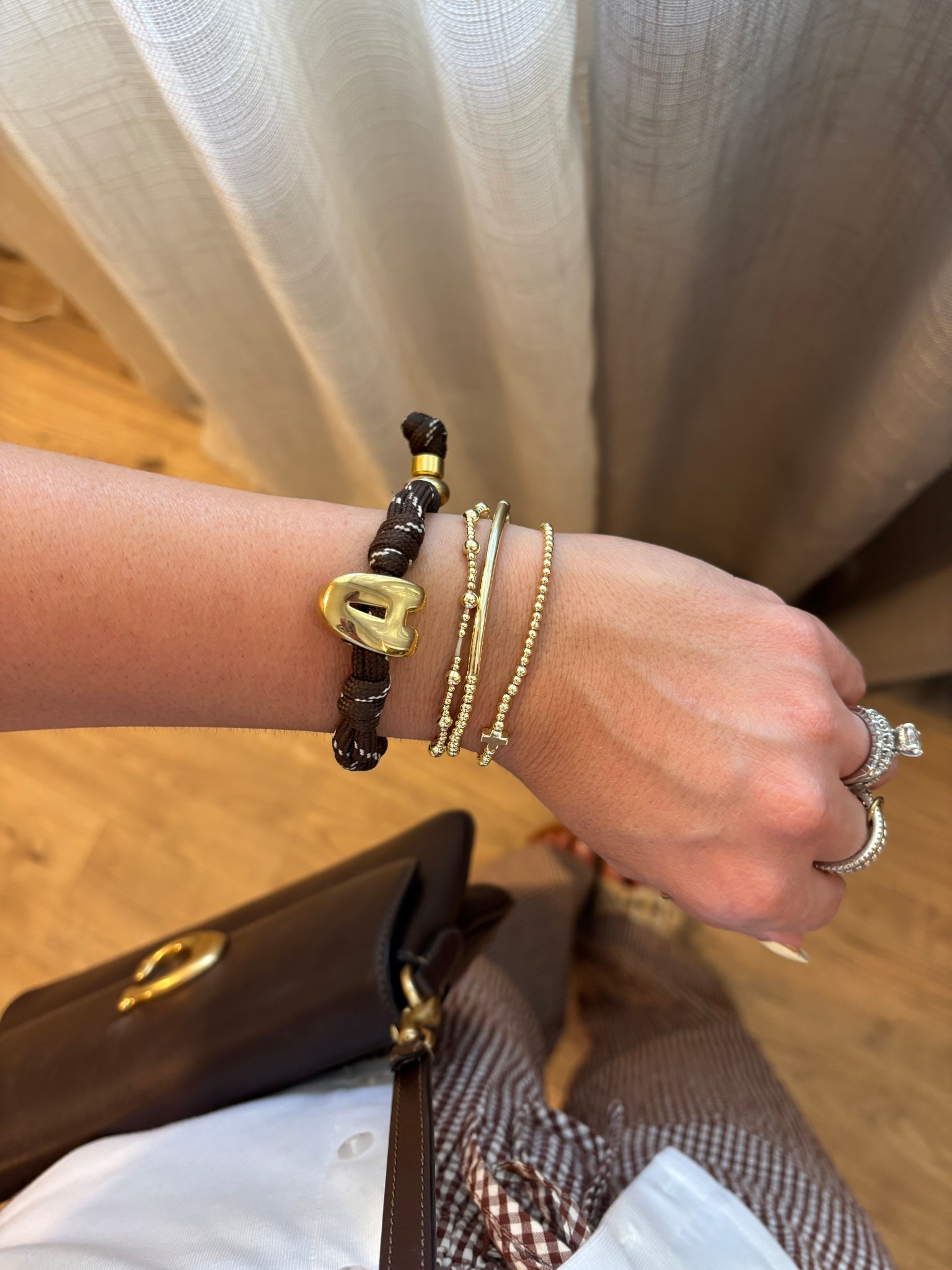 My accessories! This initial custom brown bracelet from Baublebar has been a trending item for a while!

#LTKdayinmylife #LTKgrwm #LTKootd