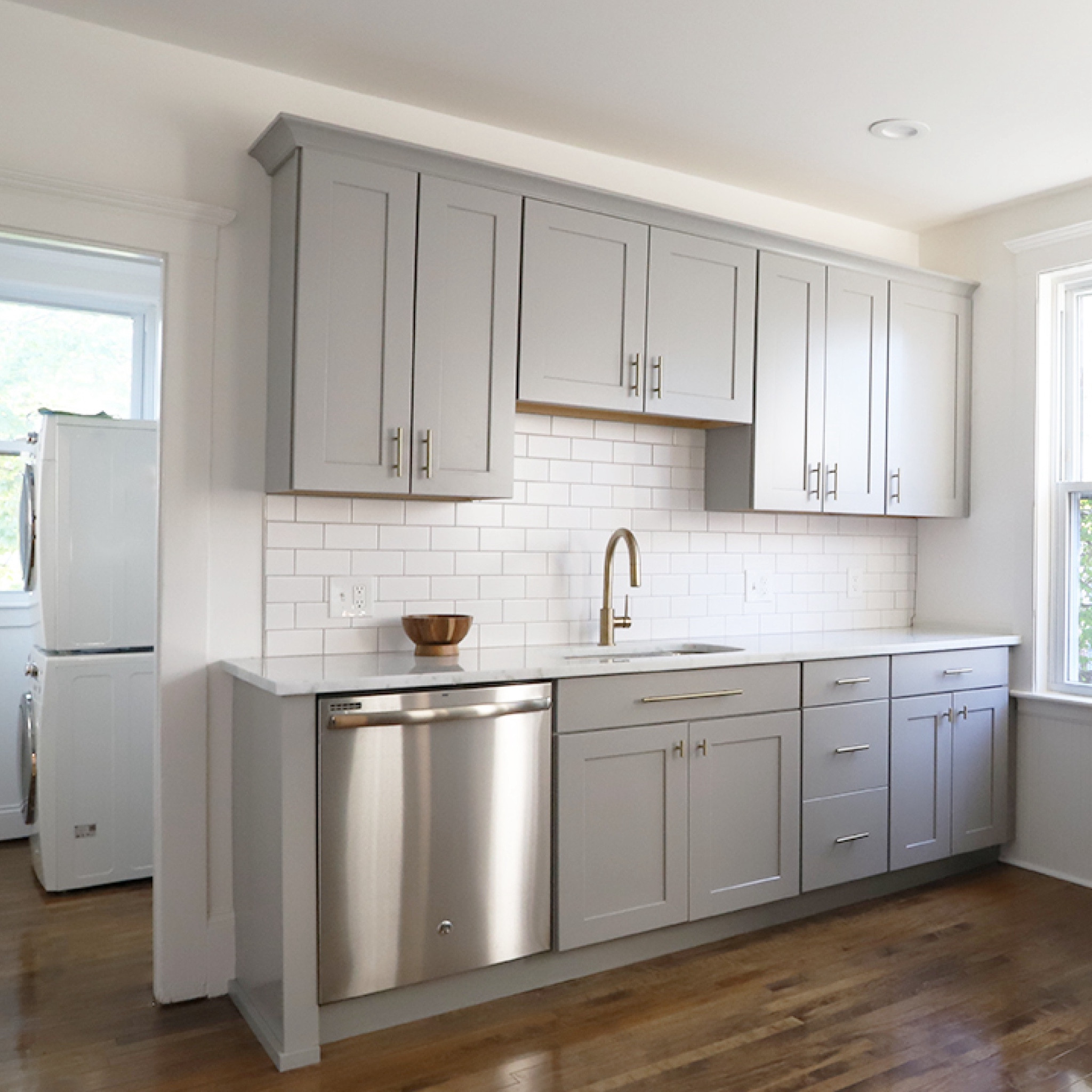 simple layout changes can make a huge difference in the looks and functionality of a space! if you swipe to see the before photo, you'll notice that the toilet was the centerpiece of the kitchen in the original layout of the #startercondo. we closed up a doorway and ran cabinets along the new wall, increasing the amount of storage and counter space in the kitchen. the bathroom door was relocated so you entered through the laundry room. personally, we found this floor plan much more appealing. our blog with more details and sourcing info is coming soon. #dwelloctober

#LTKhome