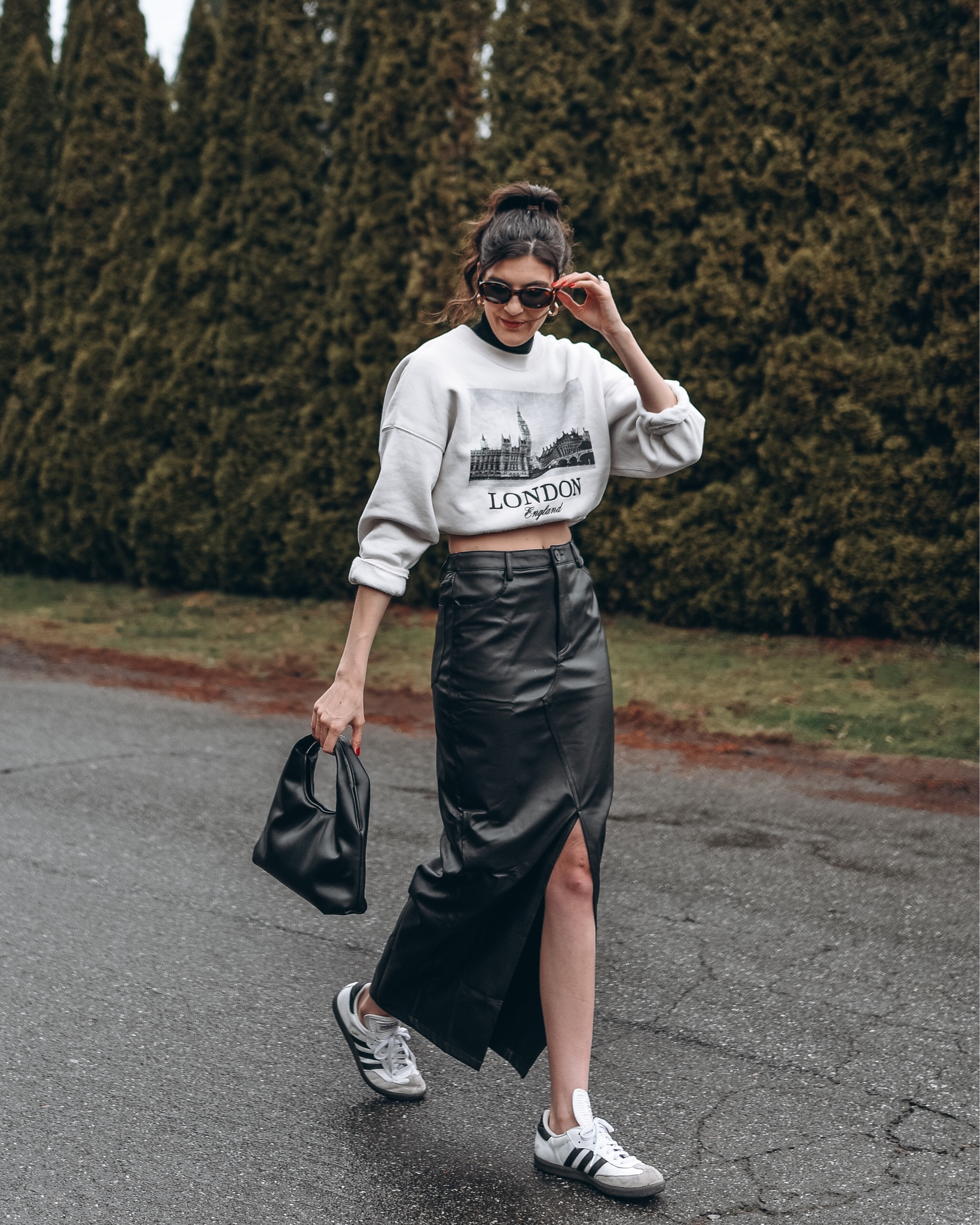 Winter outfit featuring:

Short sleeve mock neck top, crewneck sweatshirt, faux leather maxi skirt, and samba sneakers 



#LTKfindsunder100 #LTKSeasonal #LTKshoecrush