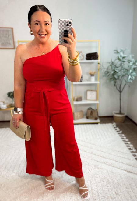 One of the most gorgeous jumpsuits I’ve ever tried on and it’s so comfy too!  The material is soft and stretchy! The strap is adjustable in the back too!  

XL in mine. 
XL Shapewear shorts. 
38DD strapless bra. 
Sandals run tts  

#LTKFindsUnder50 #LTKSeasonal #LTKMidsize