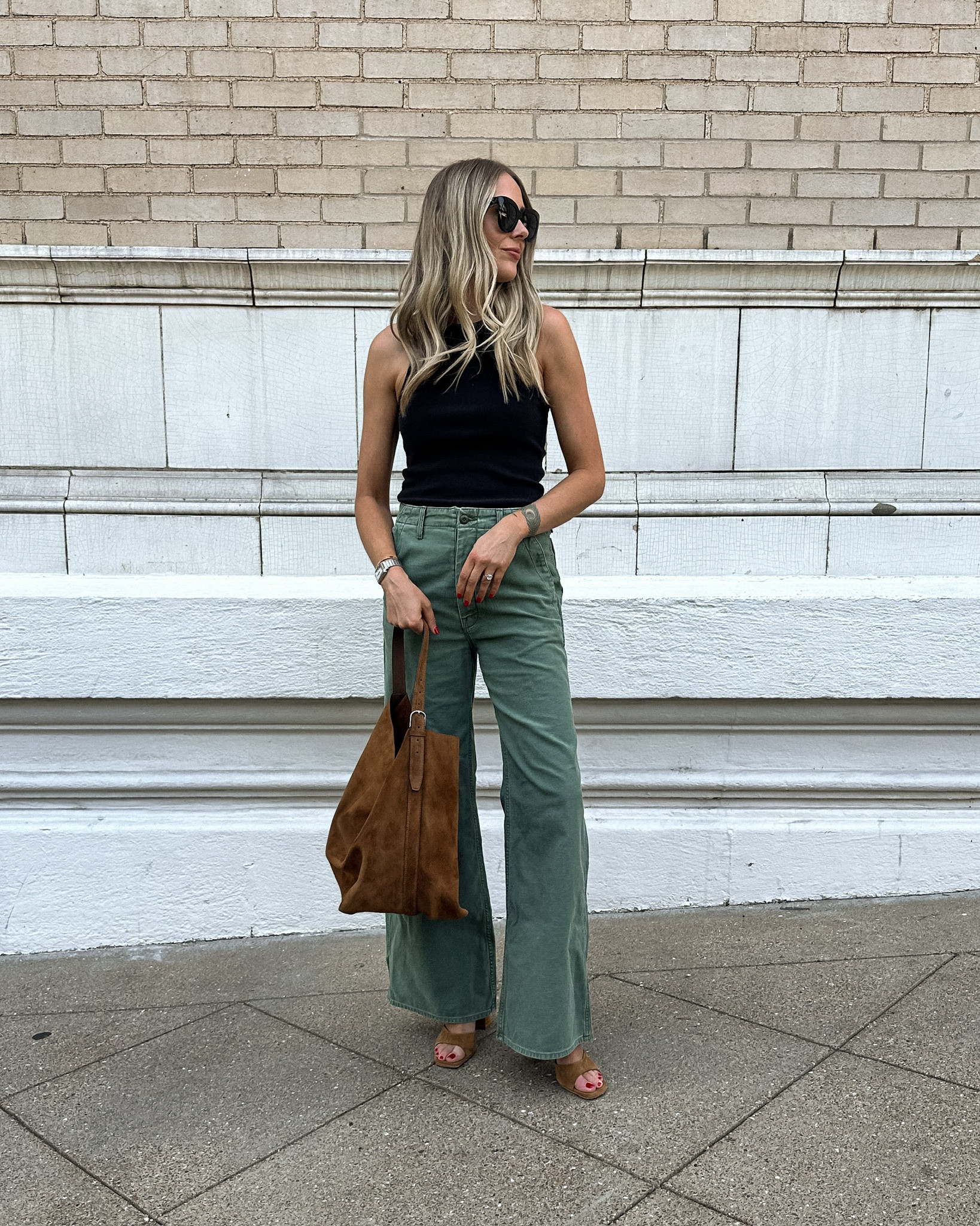 Fashion Jackson wearing black tank (small) green pants (tts) suede handbag (linked similar) suede sandals (tts) #fashionjackson #shopbop #summeroutfits 

#LTKOver40 #LTKFindsUnder100 #LTKStyleTip