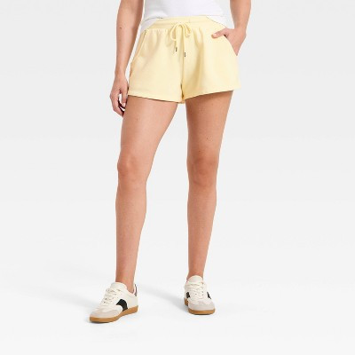 Women's Mid-Rise Fleece Cozy Pull-On Shorts - Universal Thread™ Yellow XL | Target
