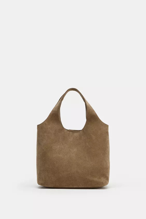 Mini Shopper aus Leder. Zwei Henkel und ein abnehmbarer Schulterriemen. Innentasche mit Reißvers... | Zara DE