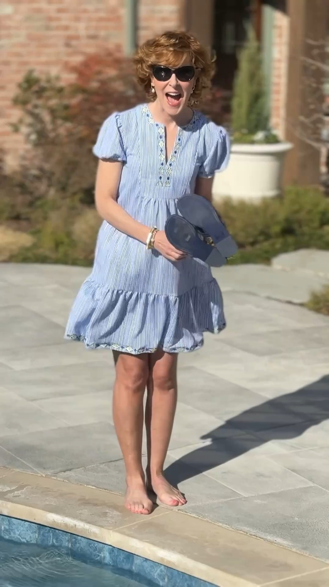 This UPF 50+ Embroidered Tiered Dress from @cabanalife is flirty, fun, and so easy to wear! 🌸

I love the seersucker fabric - different from most of the cabana Life fabrics- and the embroidered hem and neckline look so high end! 

It was in the 40s when we filmed this, and my husband dared me to go in the pool! Of course I had to do it!

Use code SUZY15 for 15% off your entire order at Cabana Life!

#LTKFindsUnder100 #LTKTravel #LTKWatchNow