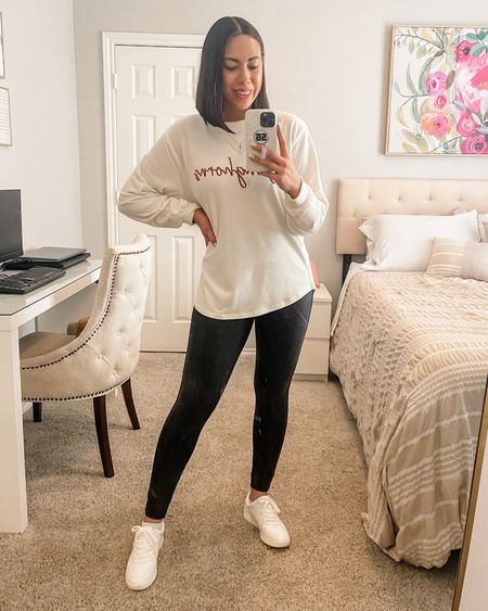I’m a sucker for a cozy travel outfit! Wearing my favorite crew neck (Hook ’Em!), leggings and sneakers.

- Crew Neck: Size Medium 
- Faux Leather Leggings: Size Medium 
- White Sneakers: Size 8

#LTKstyletip #LTKtravel