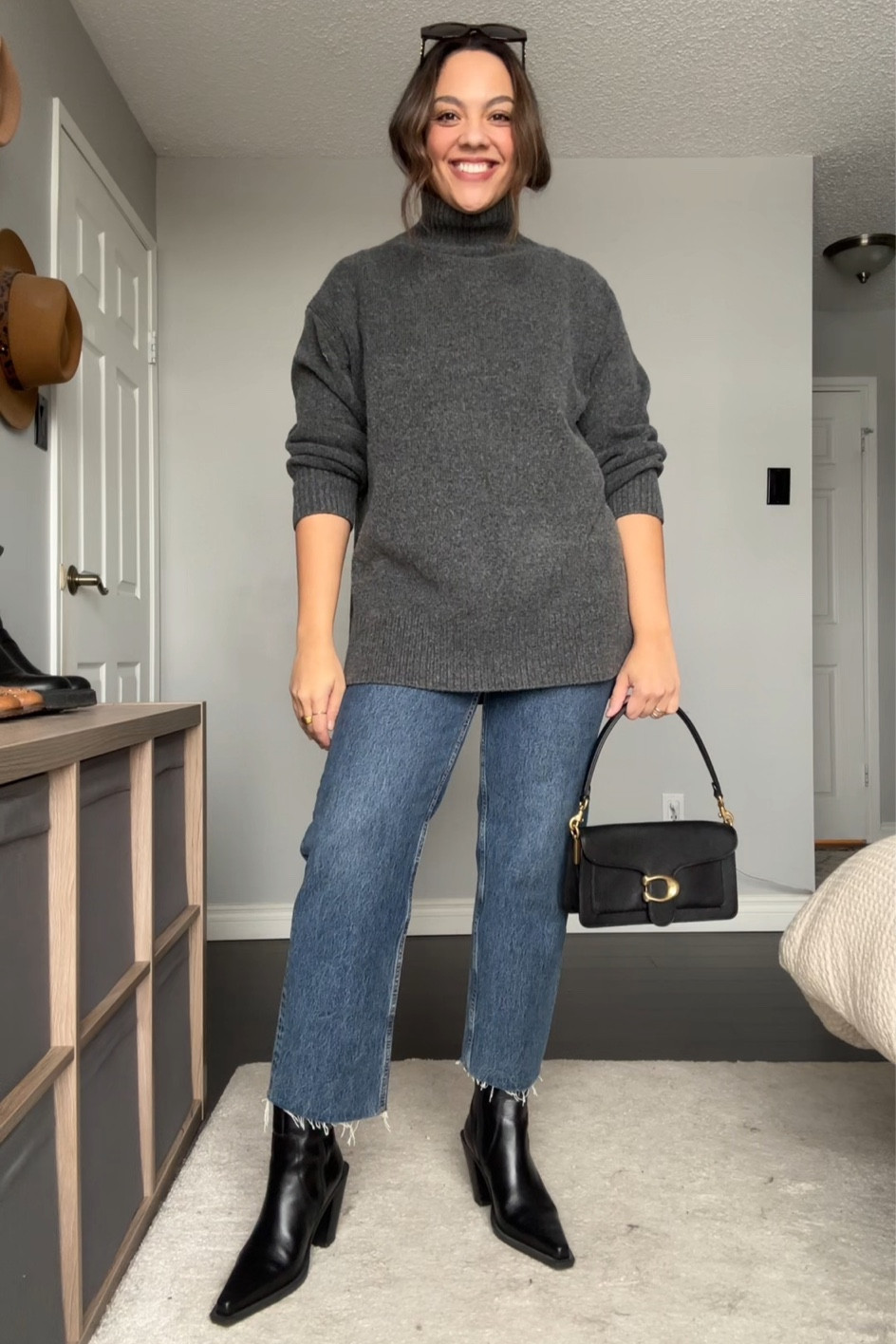 Winter outfit inspiration! Details below:
-H&M grey Mockneck long sweater, I have a size medium. 
-Anine Bing Gavin jeans, I have a size 29. Similar linked. 
-Black pointed toe ankle boots. Similar linked. 
-Coach tabby 36 shoulder bag in black. 
-Celine Triomphe sunglasses. 


#LTKstyletip #LTKSeasonal #LTKfindsunder100