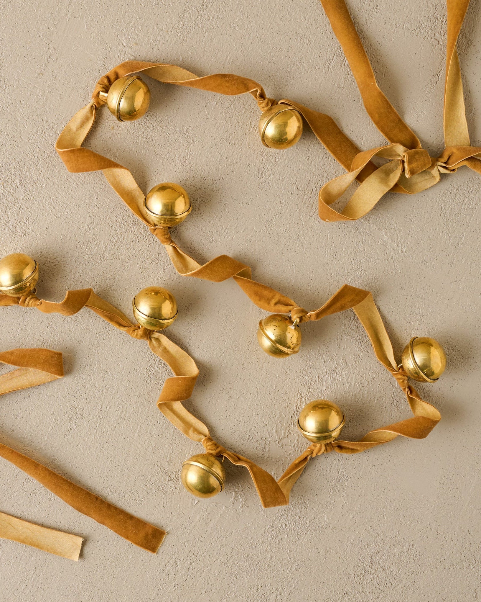 Etched Solid Brass Jingle Bell Garland | Magnolia