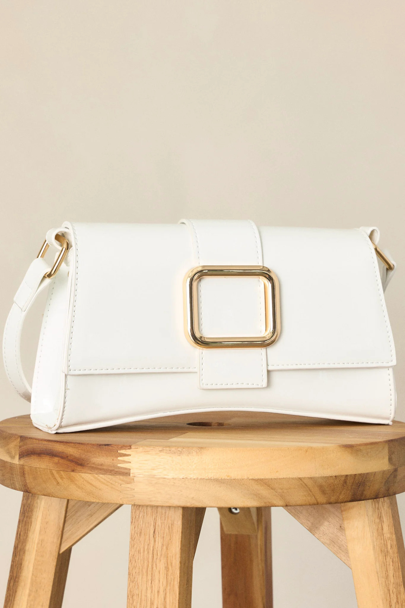 Elegant Allure Ivory Glossy Handbag | Red Dress