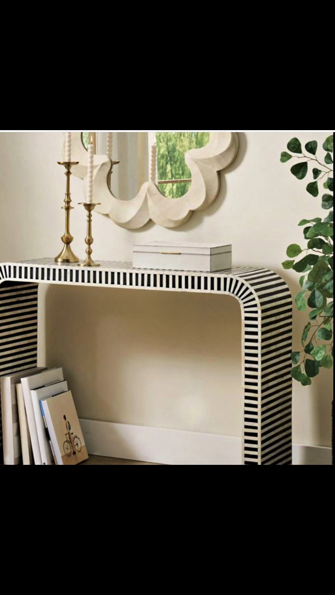 Designed with a mix of modern style and artful craftsmanship, our Soho Bone Inlay Console makes a bold statement. Inlaid bone, celebrated for its craftsmanship, natural shine and ultra-luxe look, is featured in a stunning waterfall silhouette and timeless black-and-white scheme. Perfect for adding texture, pattern, and graceful curves to any room.



#LTKHome