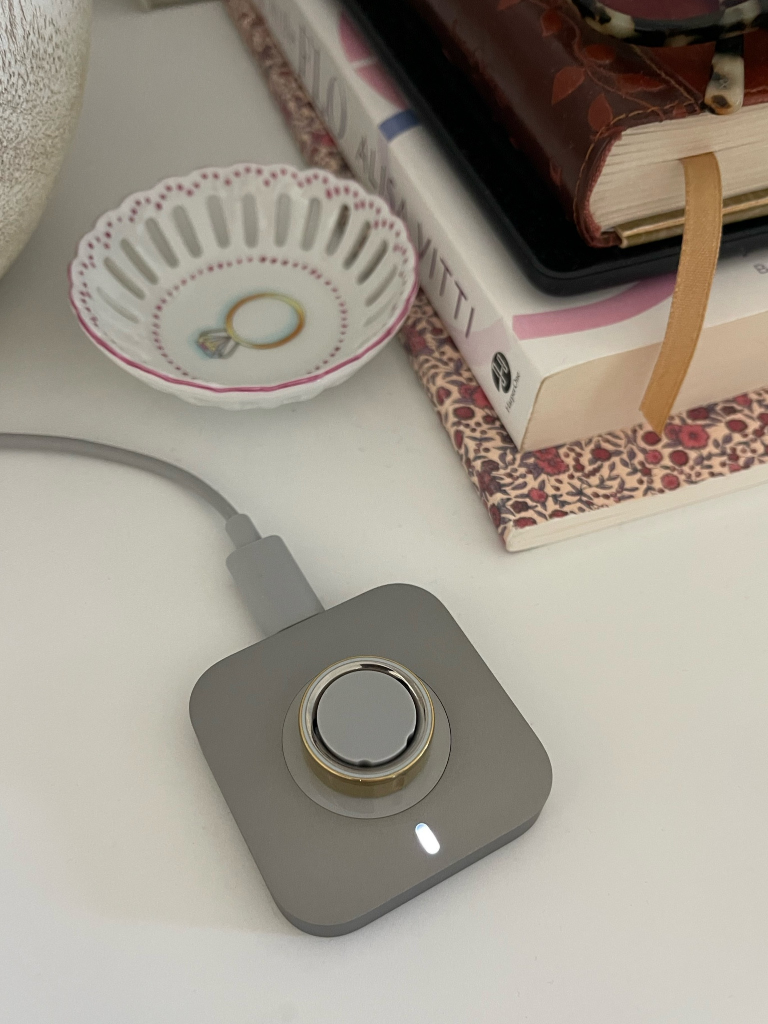 My Oura Ring 4 on the charger- the battery life is incredible, lasts up to 8 days and recharges so fast! This is the gold color, it’s so sleek and really looks like an every day ring. Highly recommend!! NOTE: you need the new sizing, so a great idea if gifting someone, is getting them a Best Buy gift card and a sizing kit- then they can size and choose their Oura accordingly 🤗 Shop now @bestbuy #bestbuypartner 

#LTKActive #LTKHoliday #LTKGiftGuide