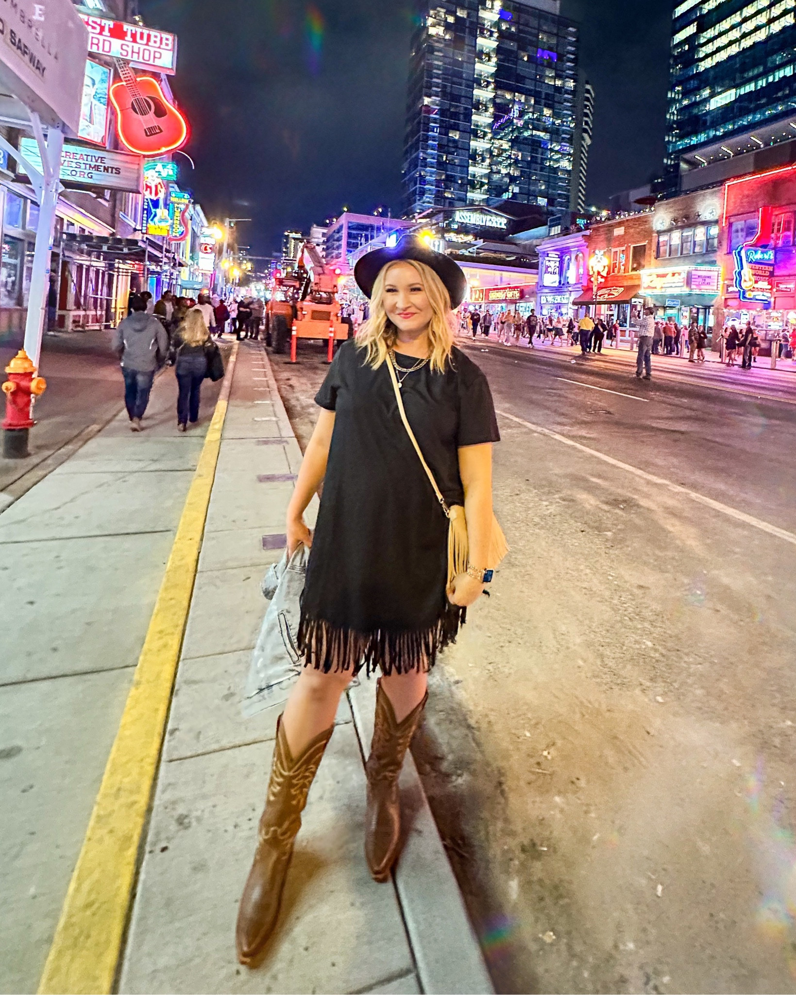 This dress was perfect for running around Nashville! 💕 Love this black fringe dress, nude fringe purse, black hat, tecovas cowboy boots and jean jacket. Nashville outfit. Country outfit  

#LTKstyletip #LTKSeasonal #LTKFind