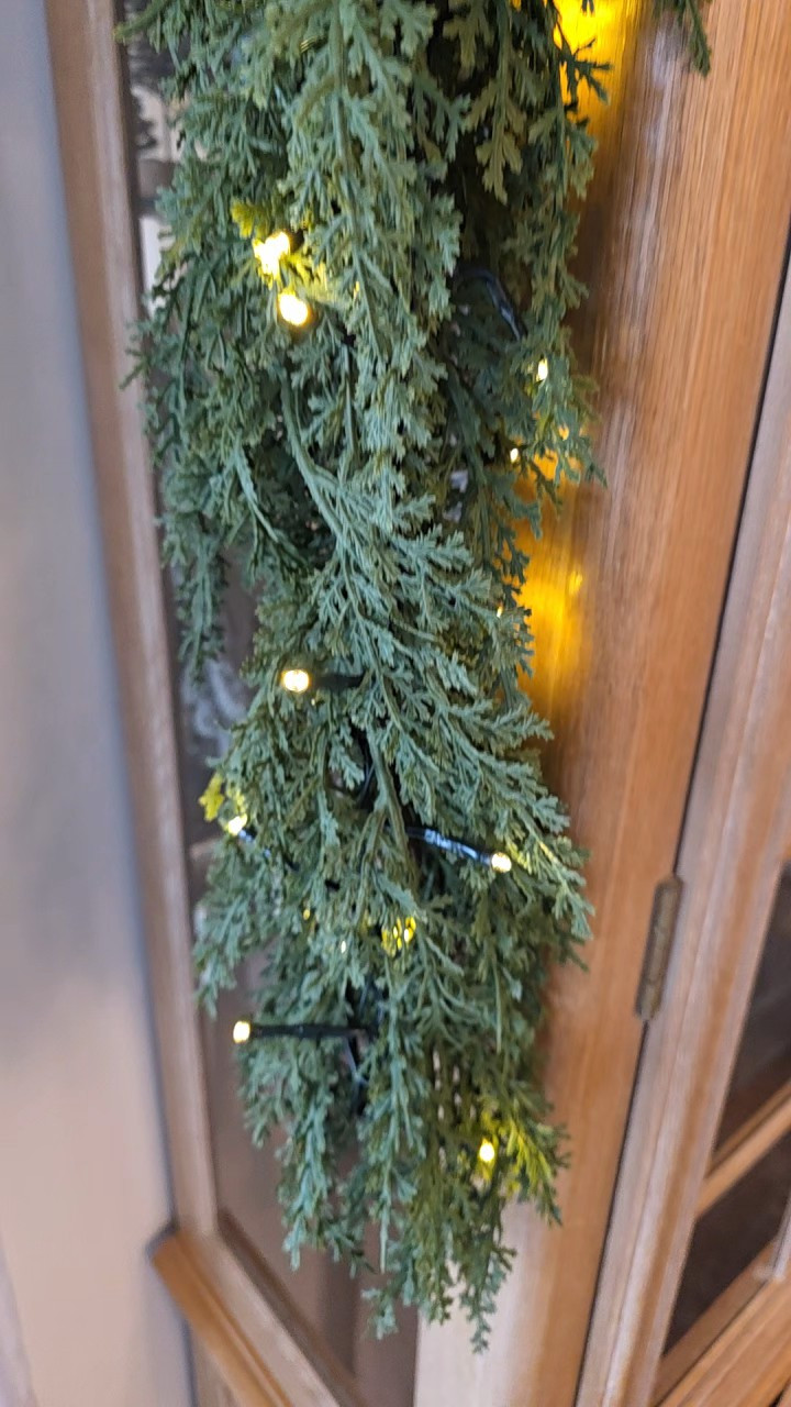 Christmas cedar garland, bell garland, cluster lights! Perfect combo for a shelf or mantle!

#LTKHoliday #LTKSeasonal #LTKHome