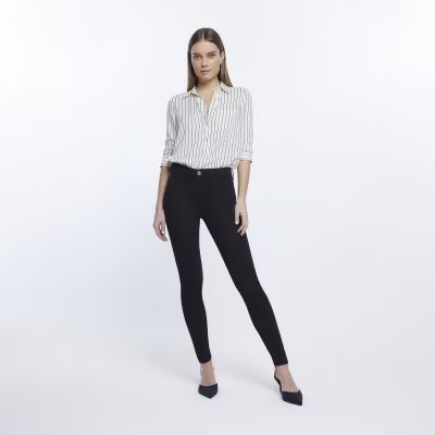 Black Molly mid rise skinny jeans | River Island (UK & IE)