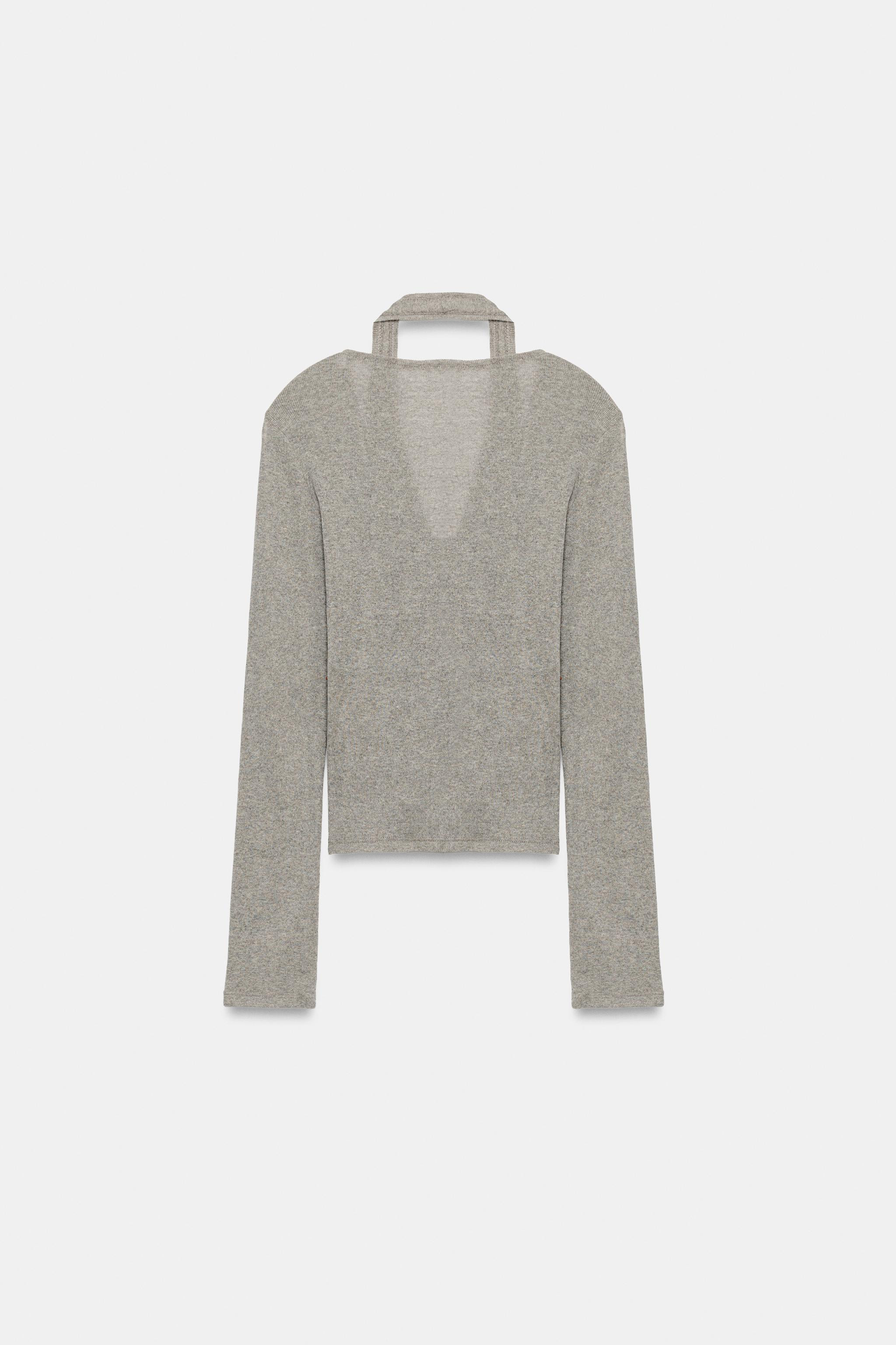 V-neck long sleeve top. Features a layered halter top effect. Front button closure. | Zara US