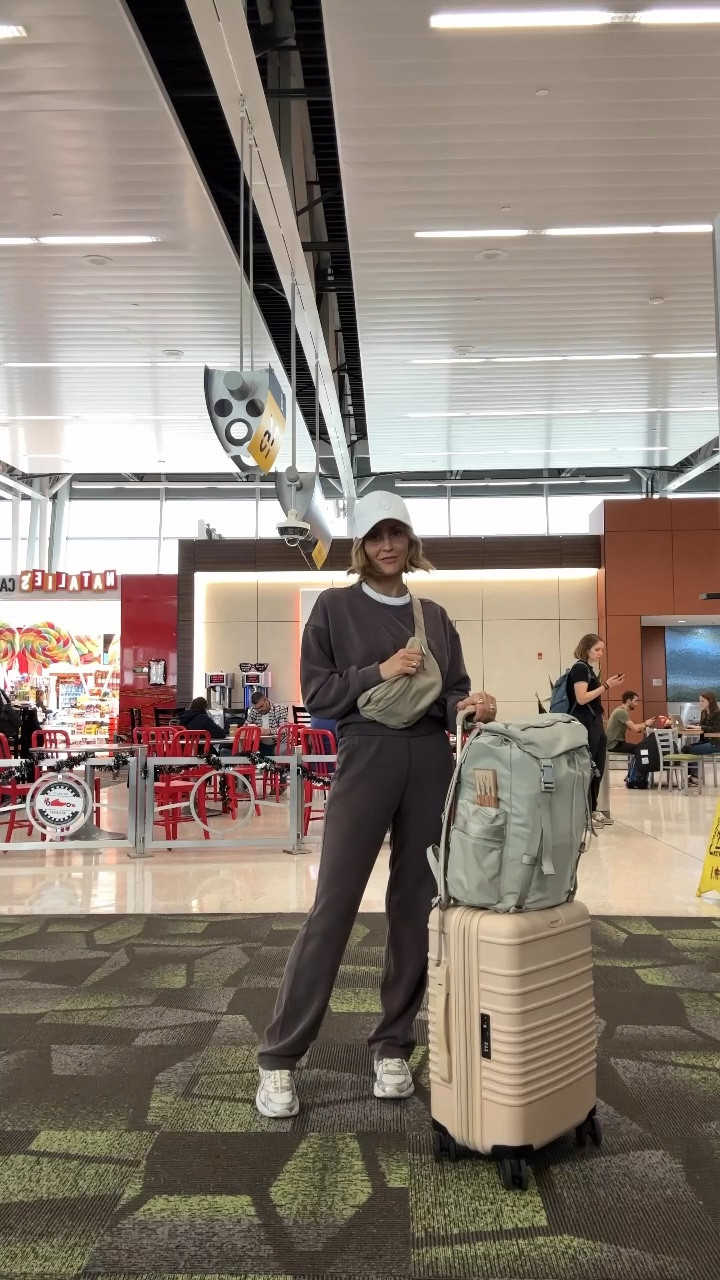 Looking for a winter travel outfit (that would also work throughout the spring?) This combo is a tried-and-true fave. These pants feel just like sweats yet they have a nice structure and an elevated look. Pair them with a matching (and equally as cozy) crewneck pullover. White sneakers, a belt bag, and a hat add the finishing touches. The pants and pullover come in several colors! 

#LTKTravel #LTKActive #LTKFindsUnder100