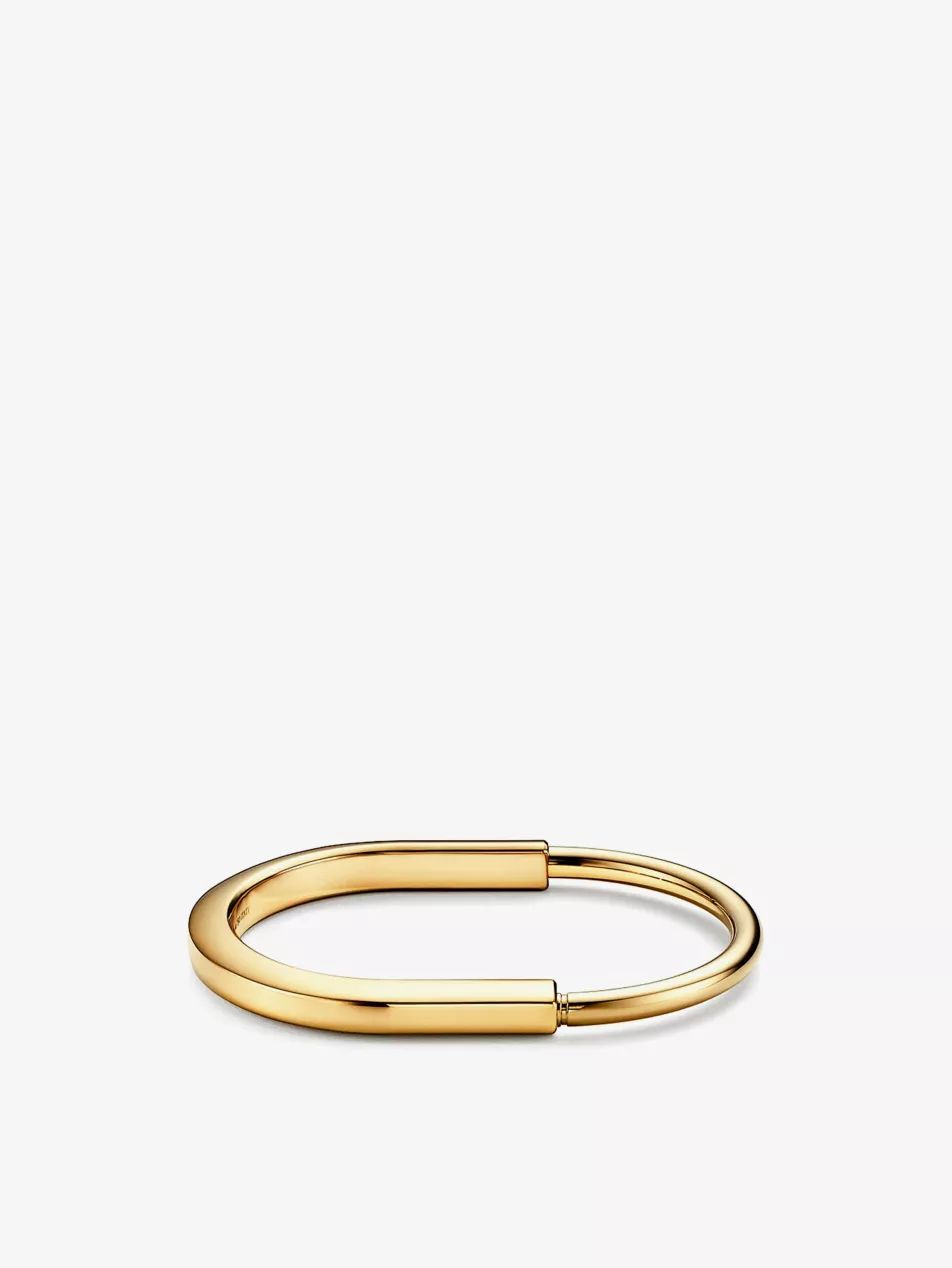Lock 18ct yellow-gold bangle bracelet | Selfridges