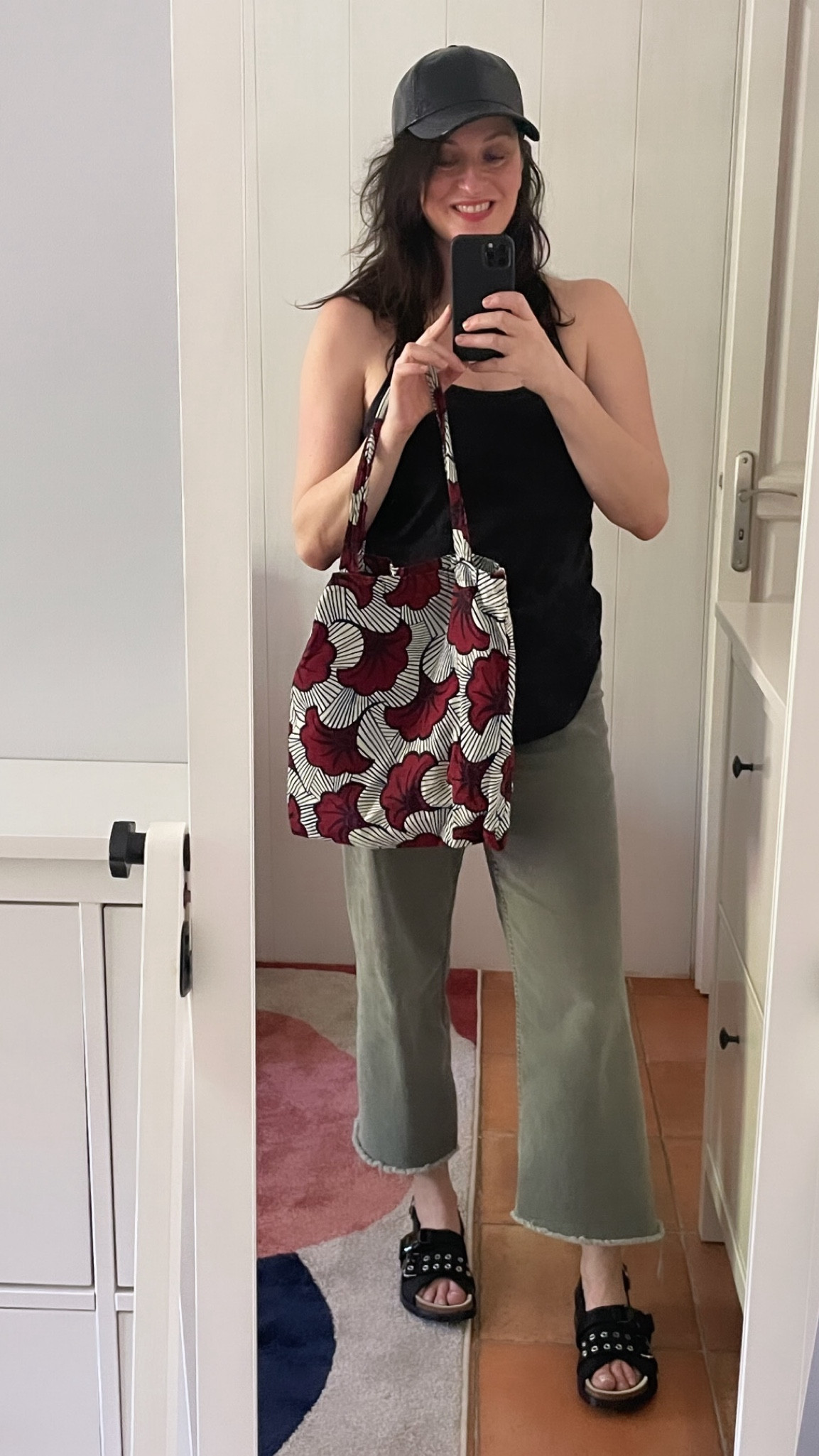 • Black patent cap #hm (linked)
• Camouflage black tank #crzyoga (linked)
• Wax print tote bag #cyrillus x #csao 
• Khaki barrel jeans #kiabi (similar, linked)
• Eyelet leather flat sandals #sacai x #apc 
• « Bêtise » Bisou Balm lipstick #violette_FR

#LTKover40 #LTKmidsize #LTKeurope