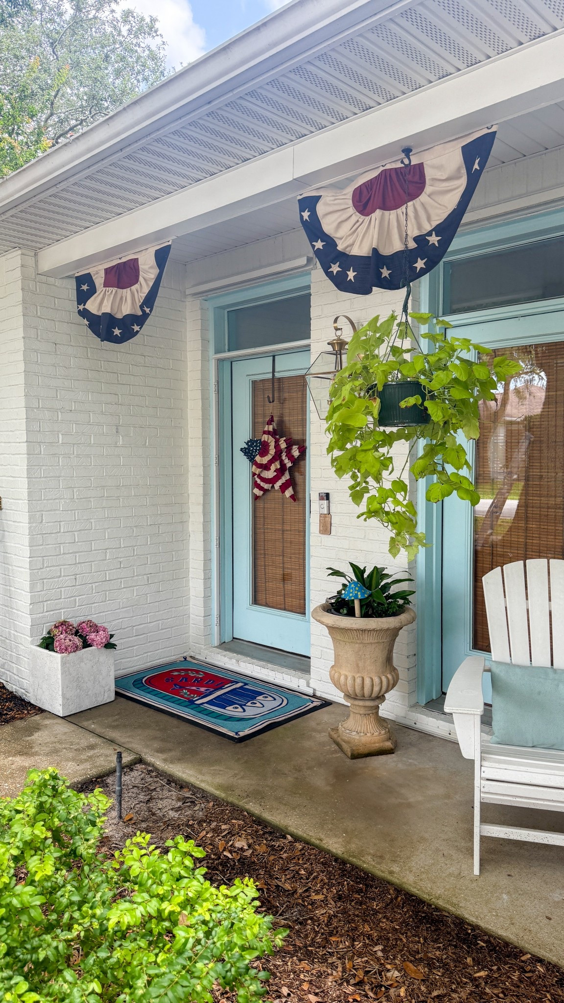 Going for Martha Stewart vacationing in Florida over 4th of July 🇺🇸 I gave our front porch a light refresh with vintage patriotic bunting, a star door hanger, and my new favorite welcome mat.

#LTKSeasonal #LTKHome