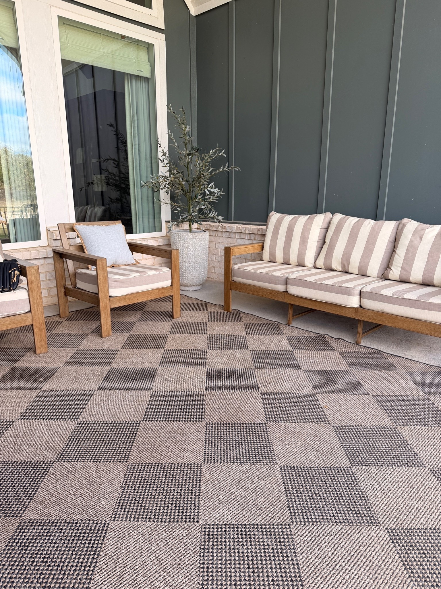 Outdoor patio, Patio decor, Patio inspiration, Covered patio, Outdoor living, Backyard patio, Patio furniture, Outdoor sofa, Outdoor lounge chairs, Striped outdoor cushions, Outdoor cushion covers, Checkered outdoor rug, Plaid outdoor rug, Neutral outdoor rug, Outdoor area rug, Wood patio furniture, Cozy patio, Traditional outdoor decor, Transitional outdoor style, Neutral patio decor, Outdoor seating area, Patio styling, Collected home, Outdoor furniture finds, Backyard inspiration