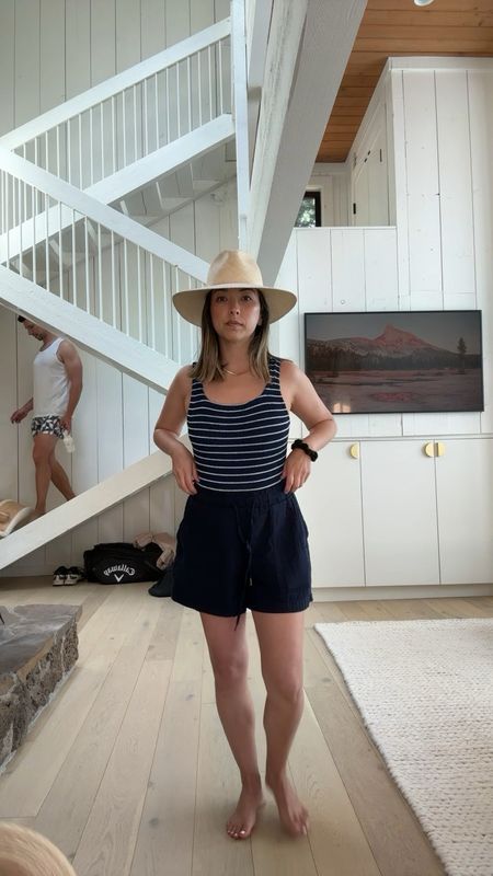 Wiw to the pool. New Hunza G swimsuit. Love this neckline. It’s higher up which I like. I have a long torso so these one size fits all work on me. 

Hunza G one piece 
Gap gauze shorts xs
Beek sandals 5
Janessa Leone hat small. Mine is old but linked similar  
Sezane tote 
Celine sunglasses  

#LTKSeasonal #LTKswim #LTKshoecrush
