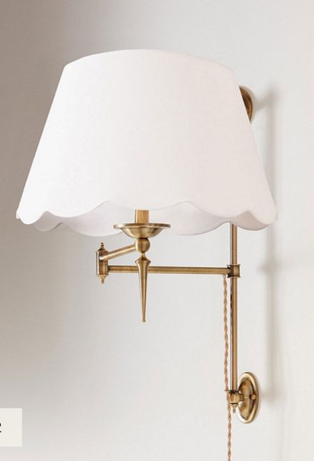 Scalloped lampshade and brass sconce!

#LTKhome