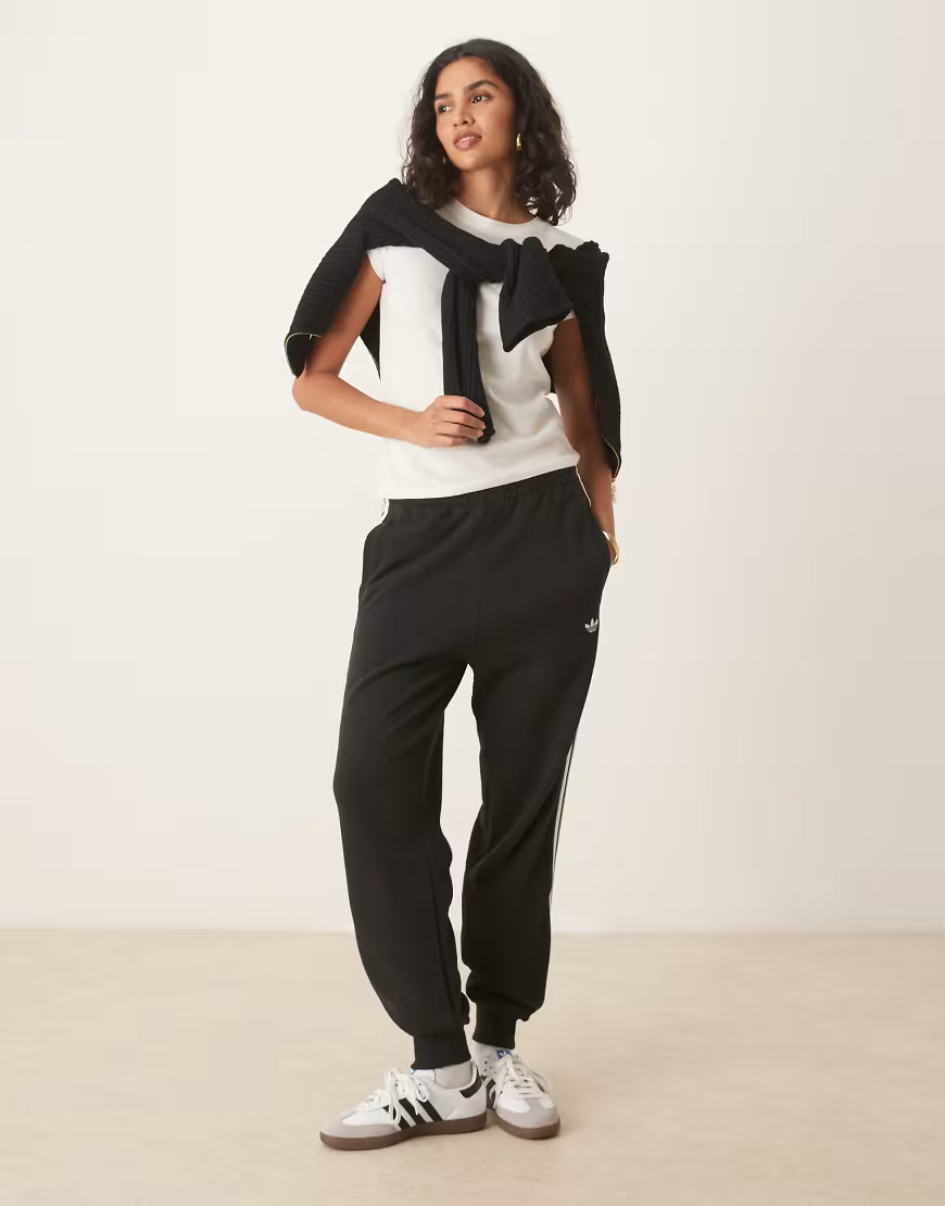 adidas Originals 3 stripe joggers in black | ASOS (Global)
